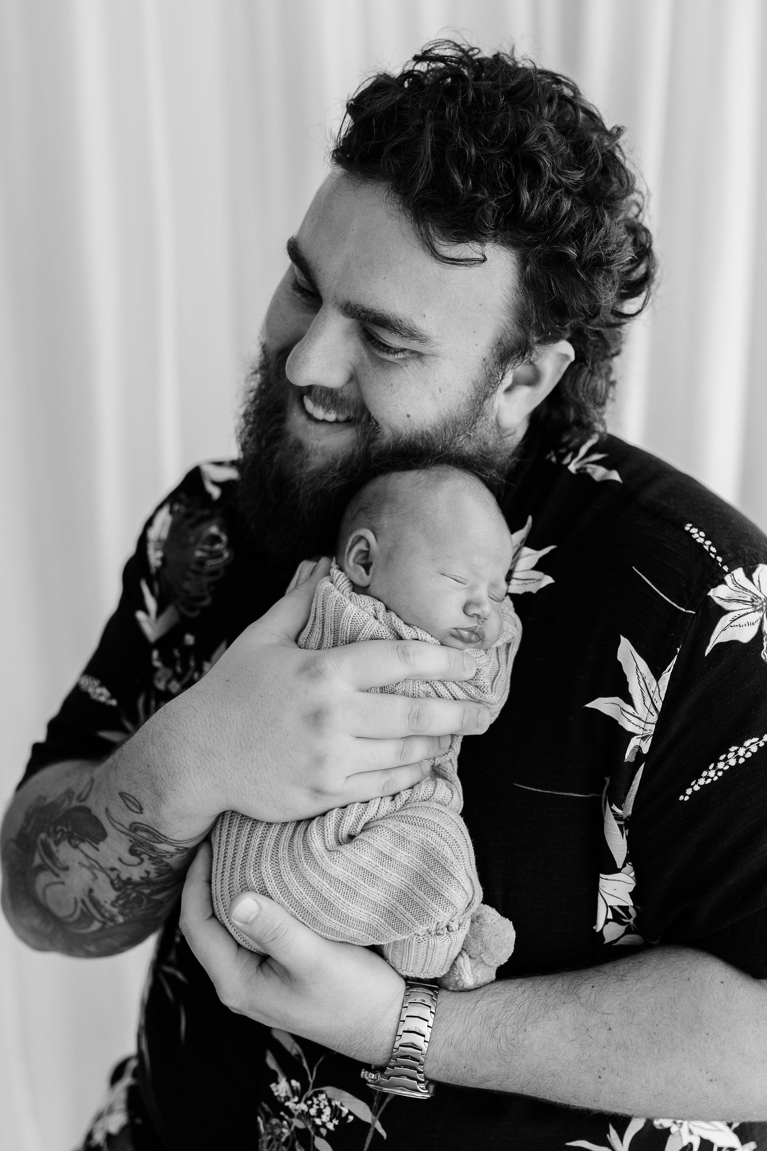 Black and white series showing tender moments with a sleeping baby.