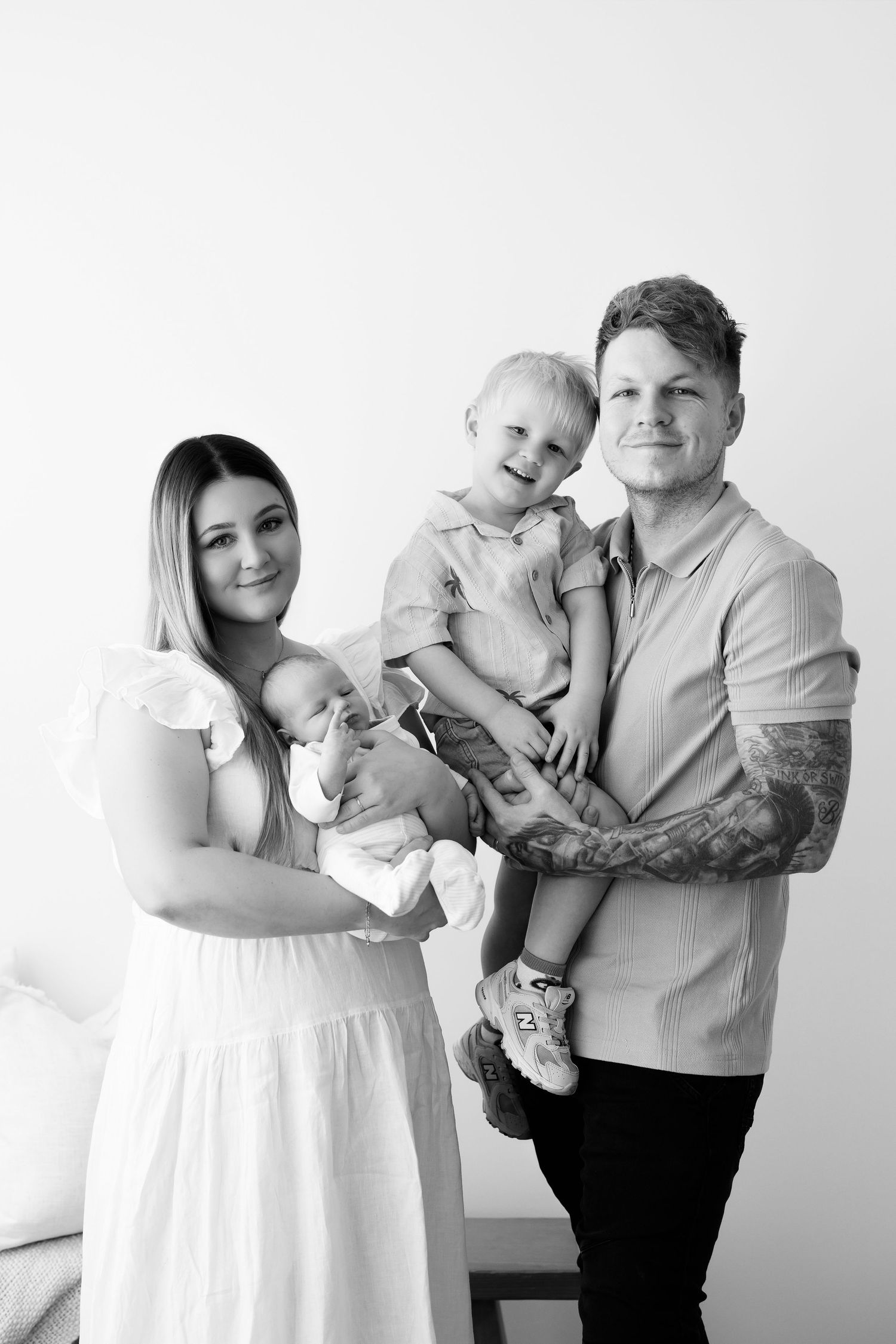 Family portrait series in black and white against a light background.