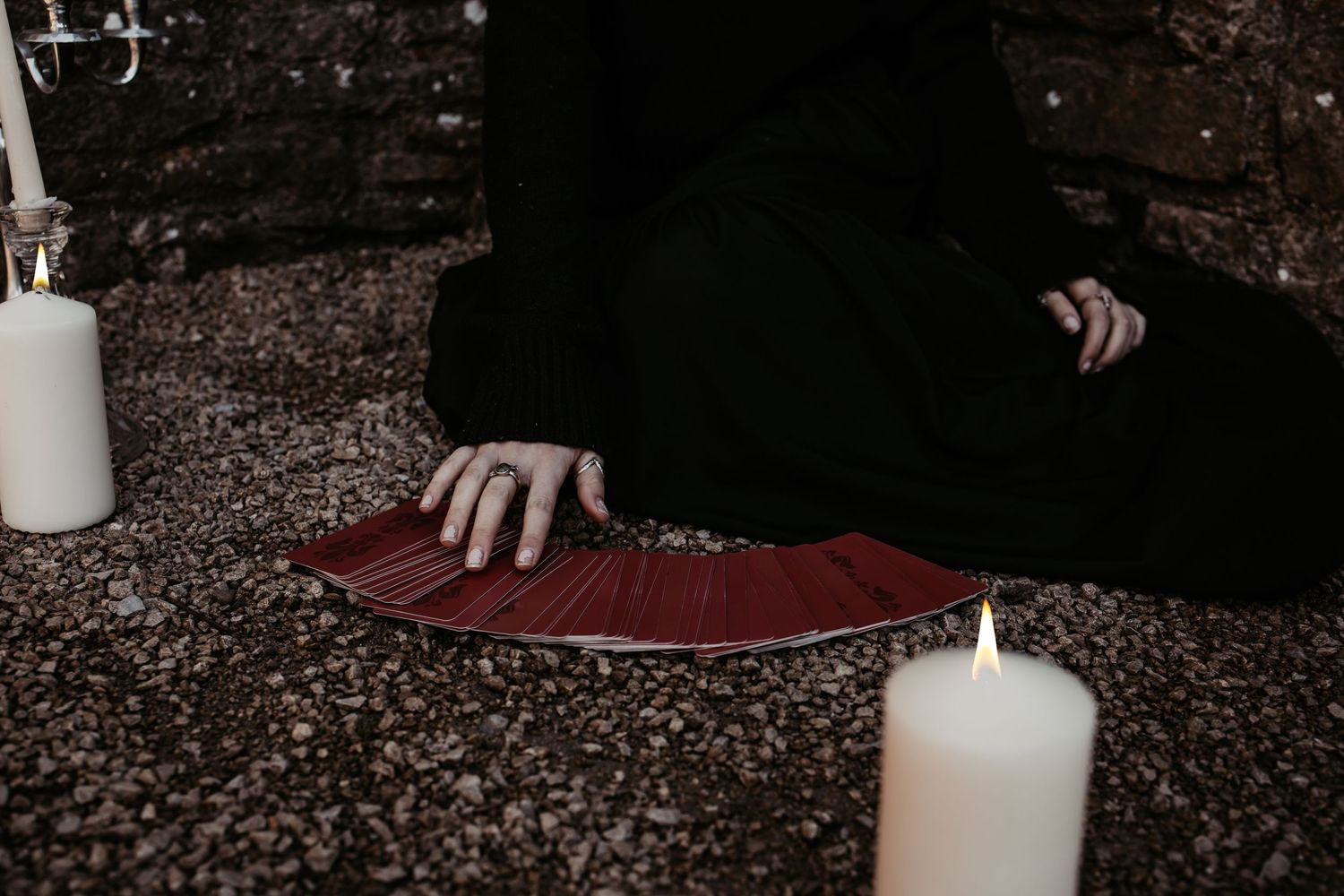 Atmospheric shot with candles and medieval props in a dark setting.