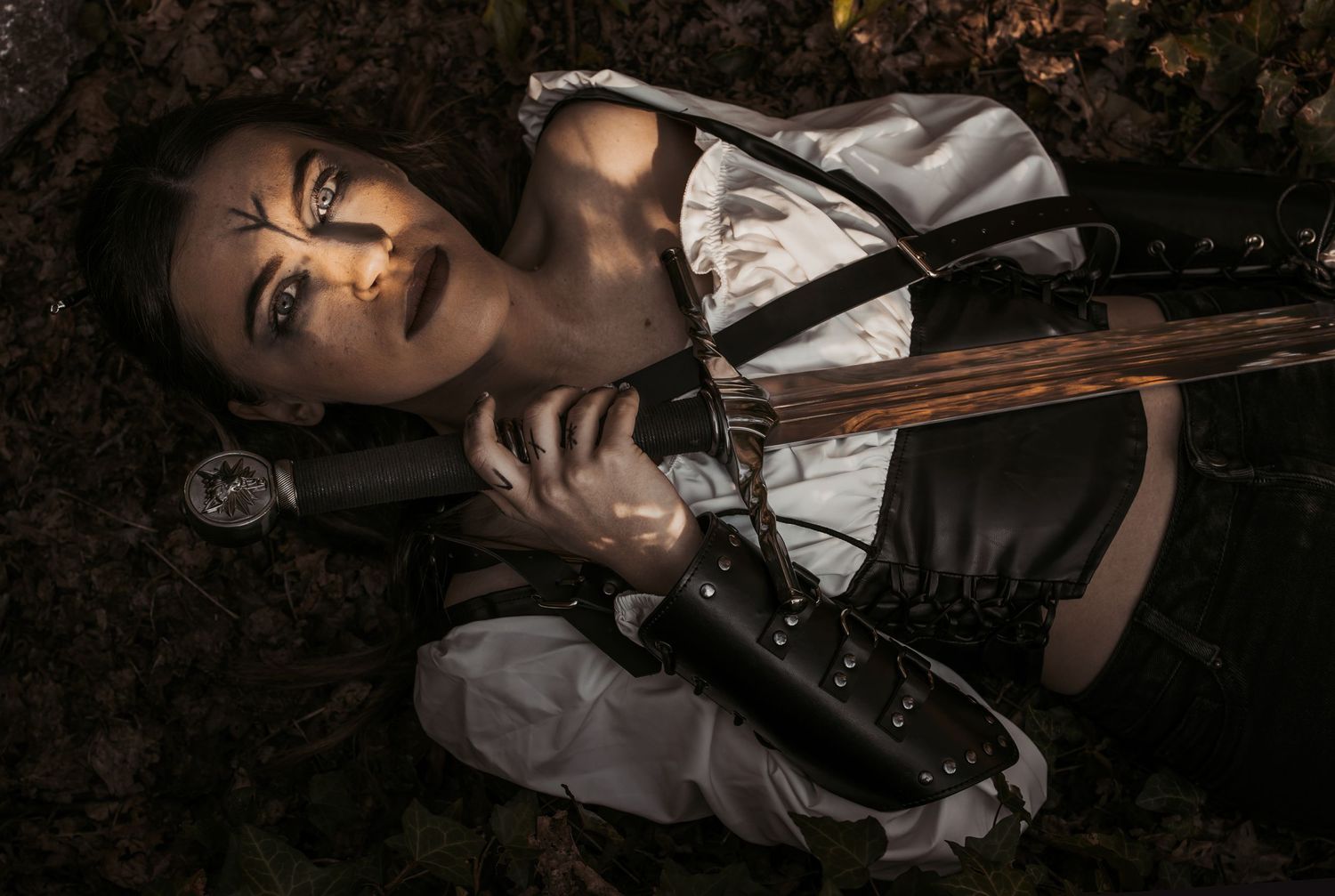 Artistic dark portrait with dramatic lighting and vintage styling.