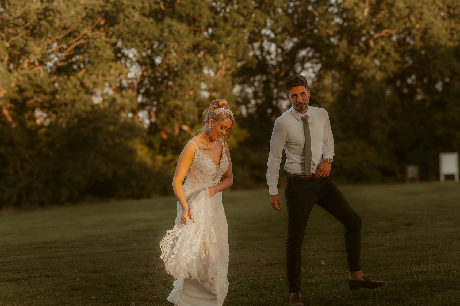 Intimate sunset wedding moments captured in a natural outdoor setting.