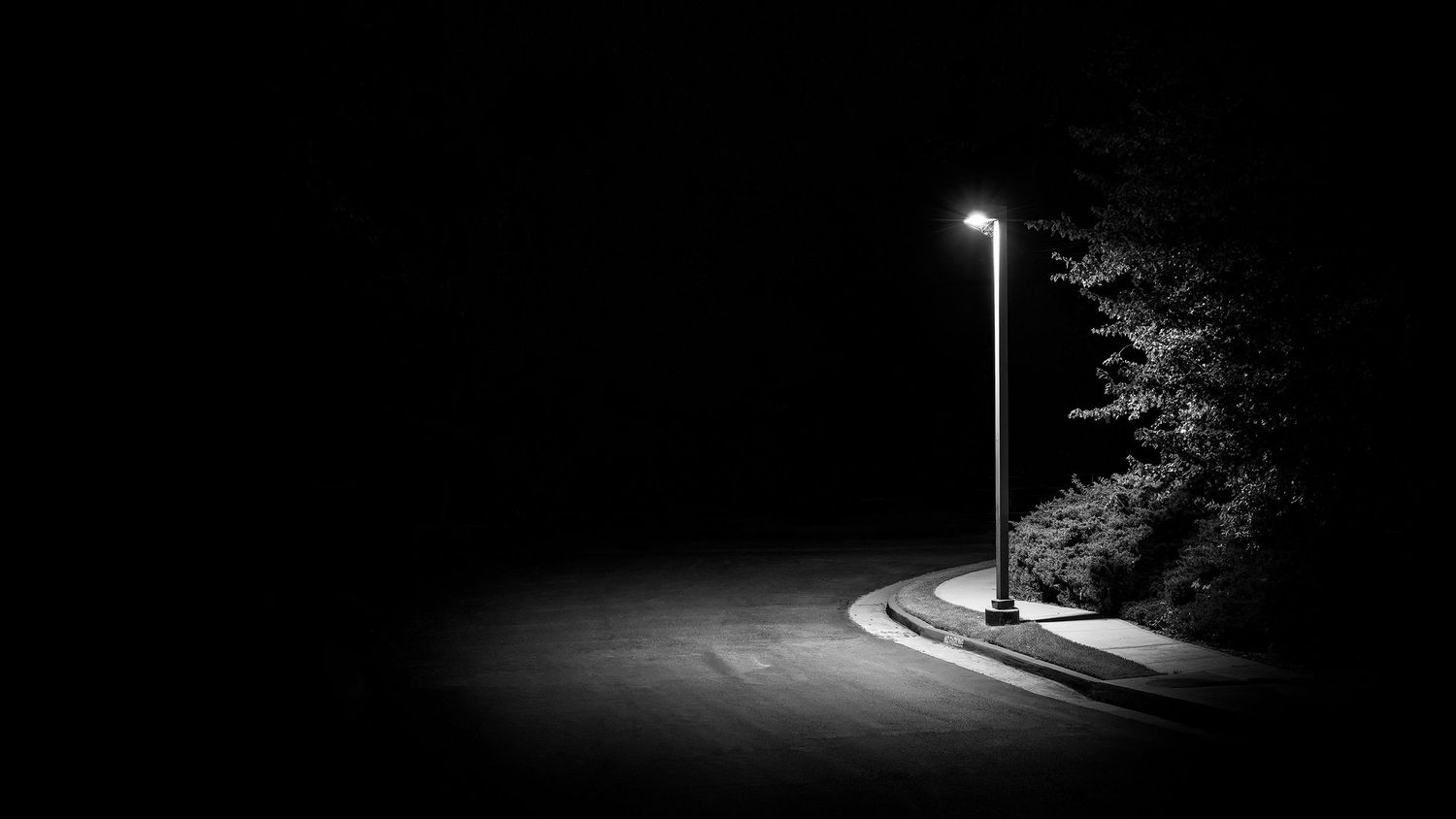 A series of dark nighttime street scenes with glowing streetlights creating dramatic shadows and lighting.