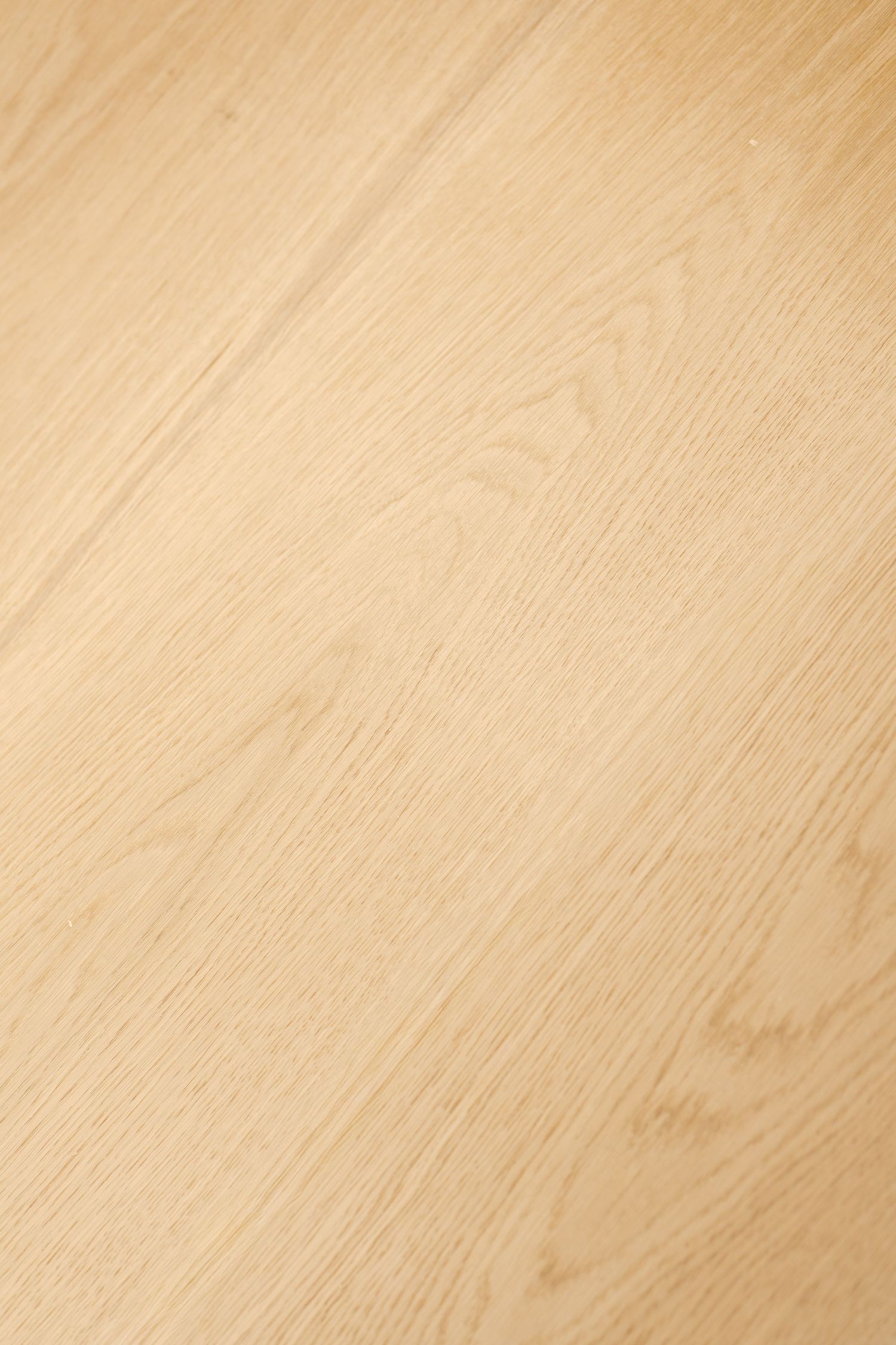 Light wood grain texture background with natural diagonal pattern.