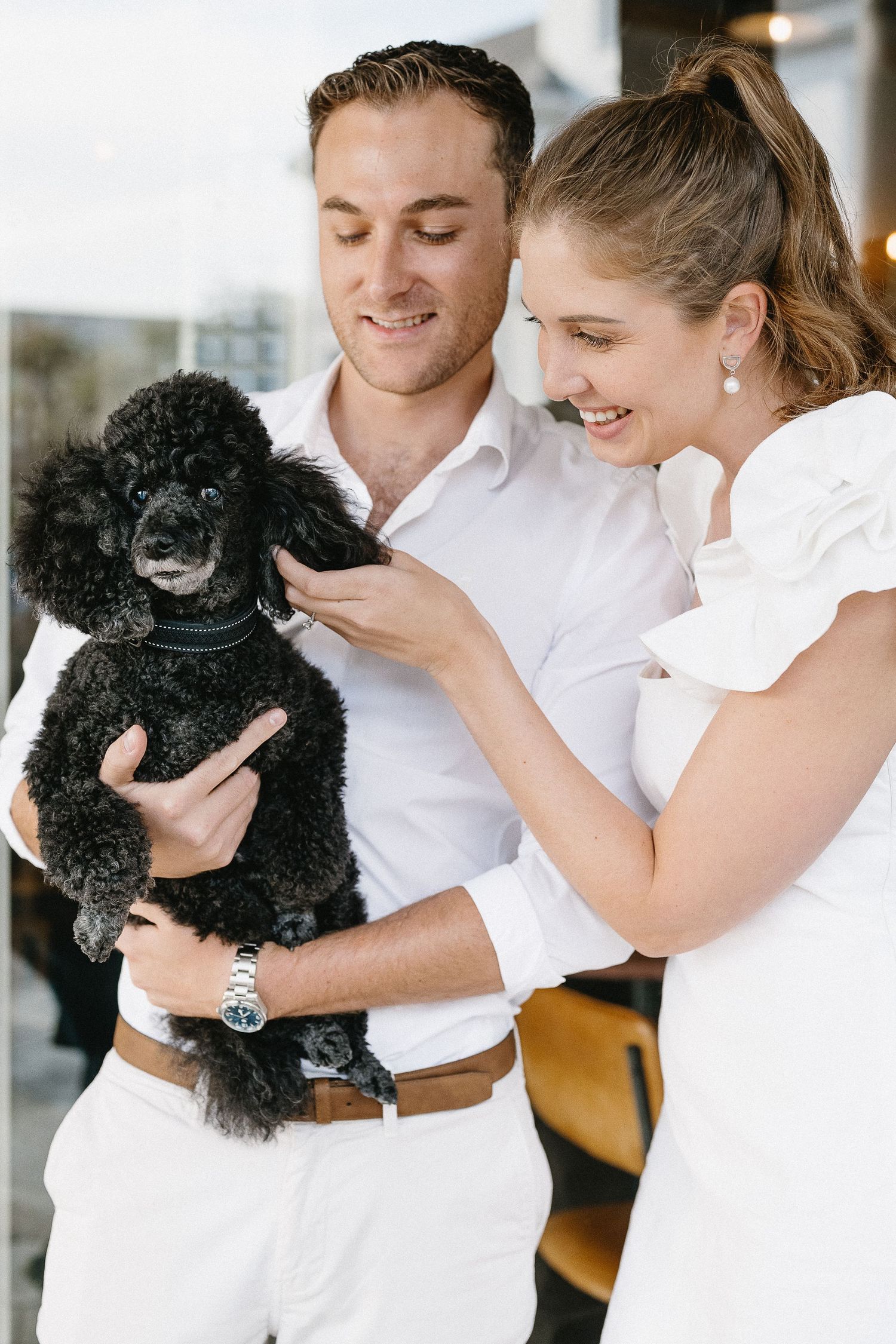 Newly engaged couple with their tiny dog having the best time in Stellenbosch.