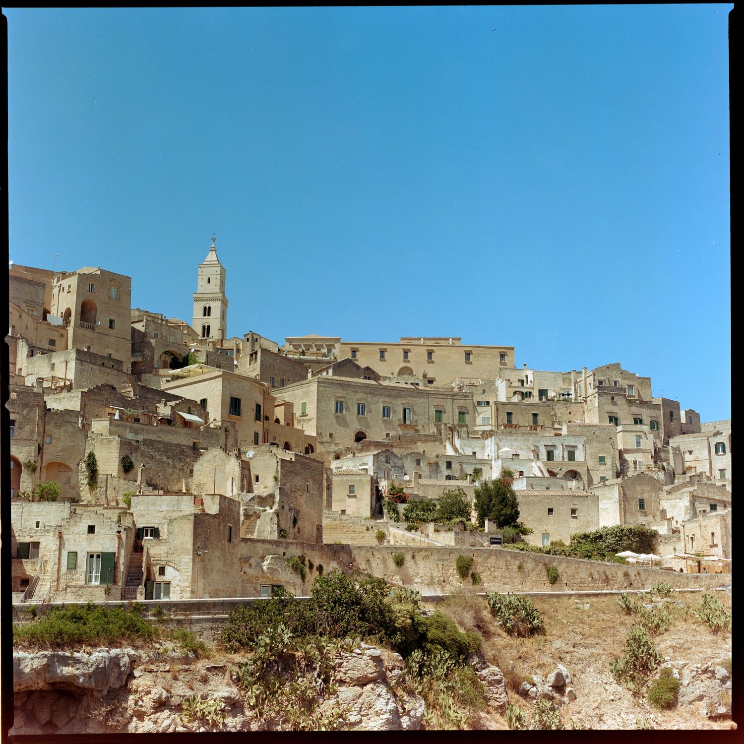 Panoramic view of ancient stone buildings and architecture in Matera, Italy showing the historic Sassi cave dwellings.