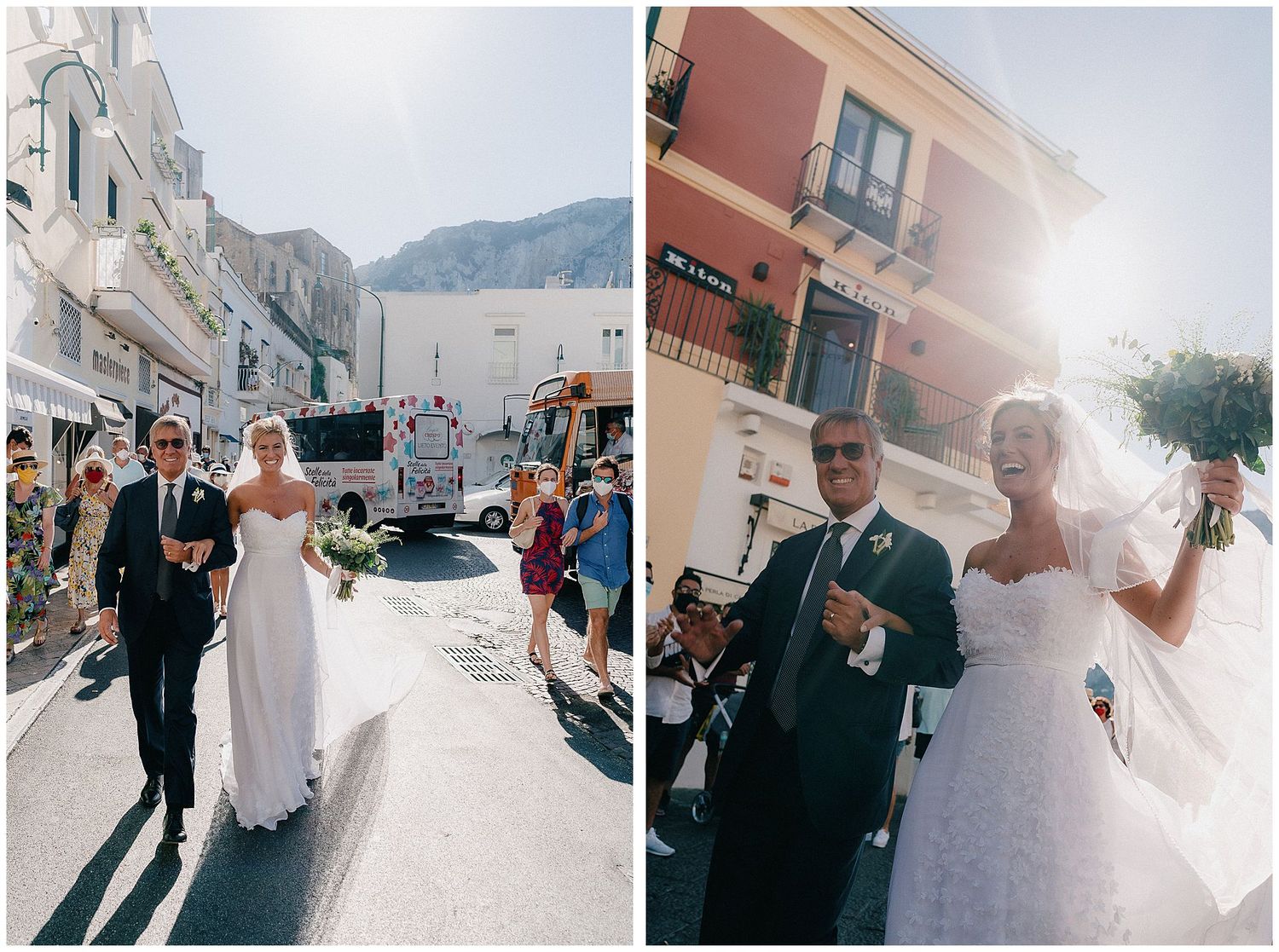 A couple in wedding attire walks down scenic European streets with sun-dappled buildings and mountains in the backdrop.