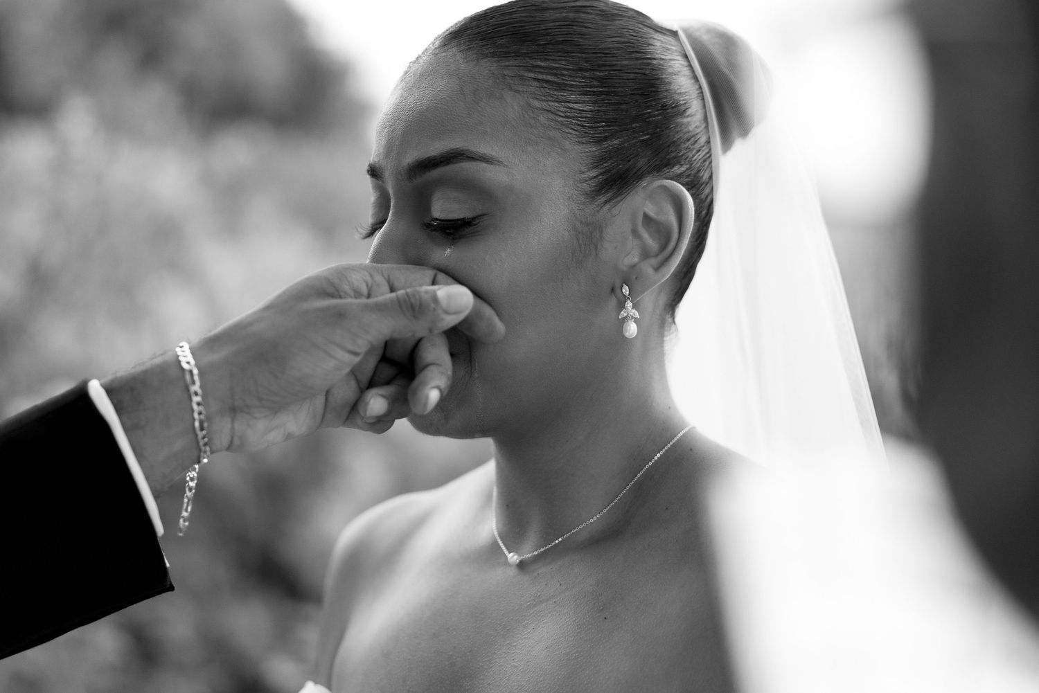 Black and white wedding photography series showing intimate romantic moments between newlyweds.