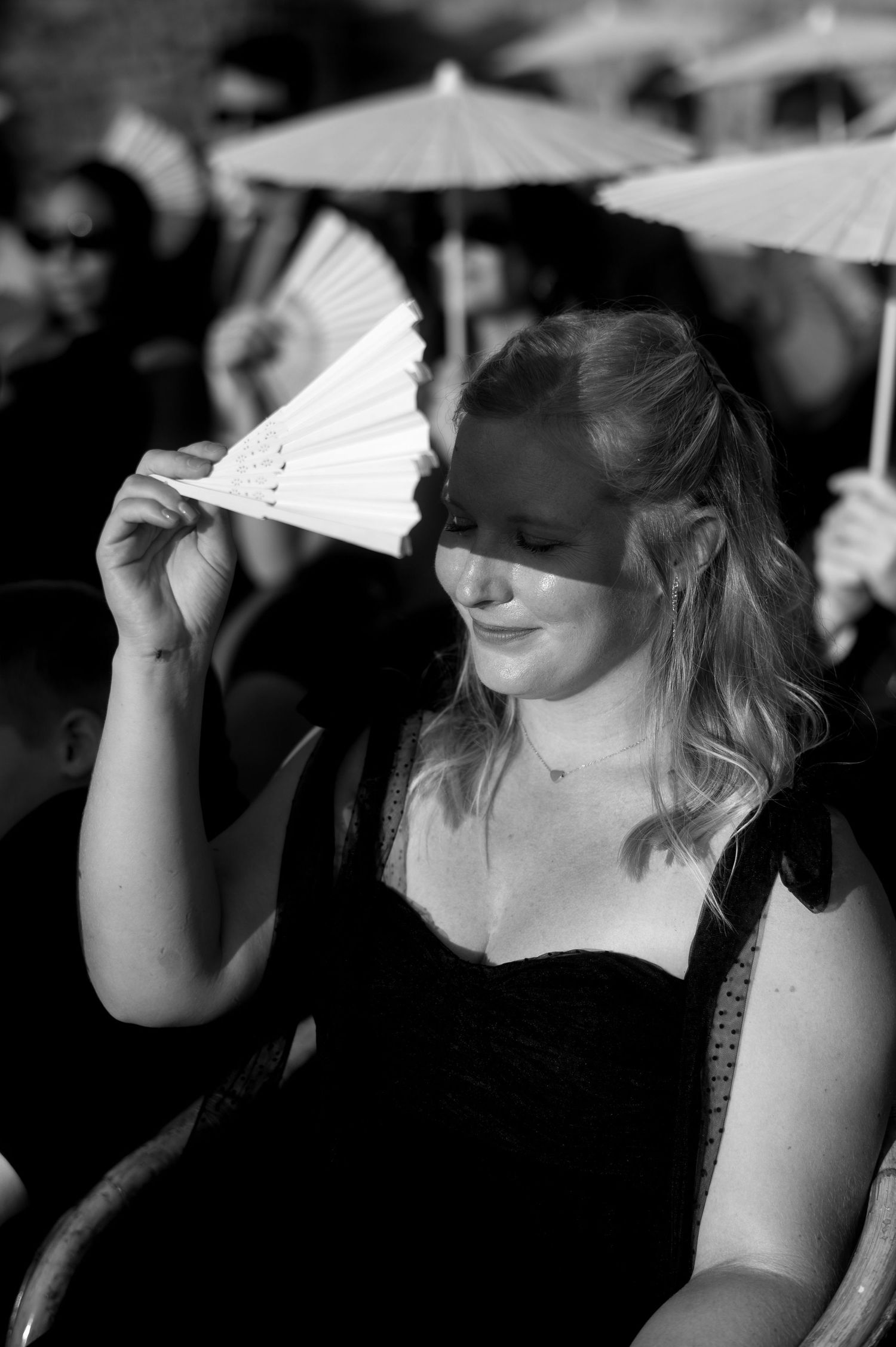 A series of black and white images showing someone wiping their face with a napkin in a progressive sequence.