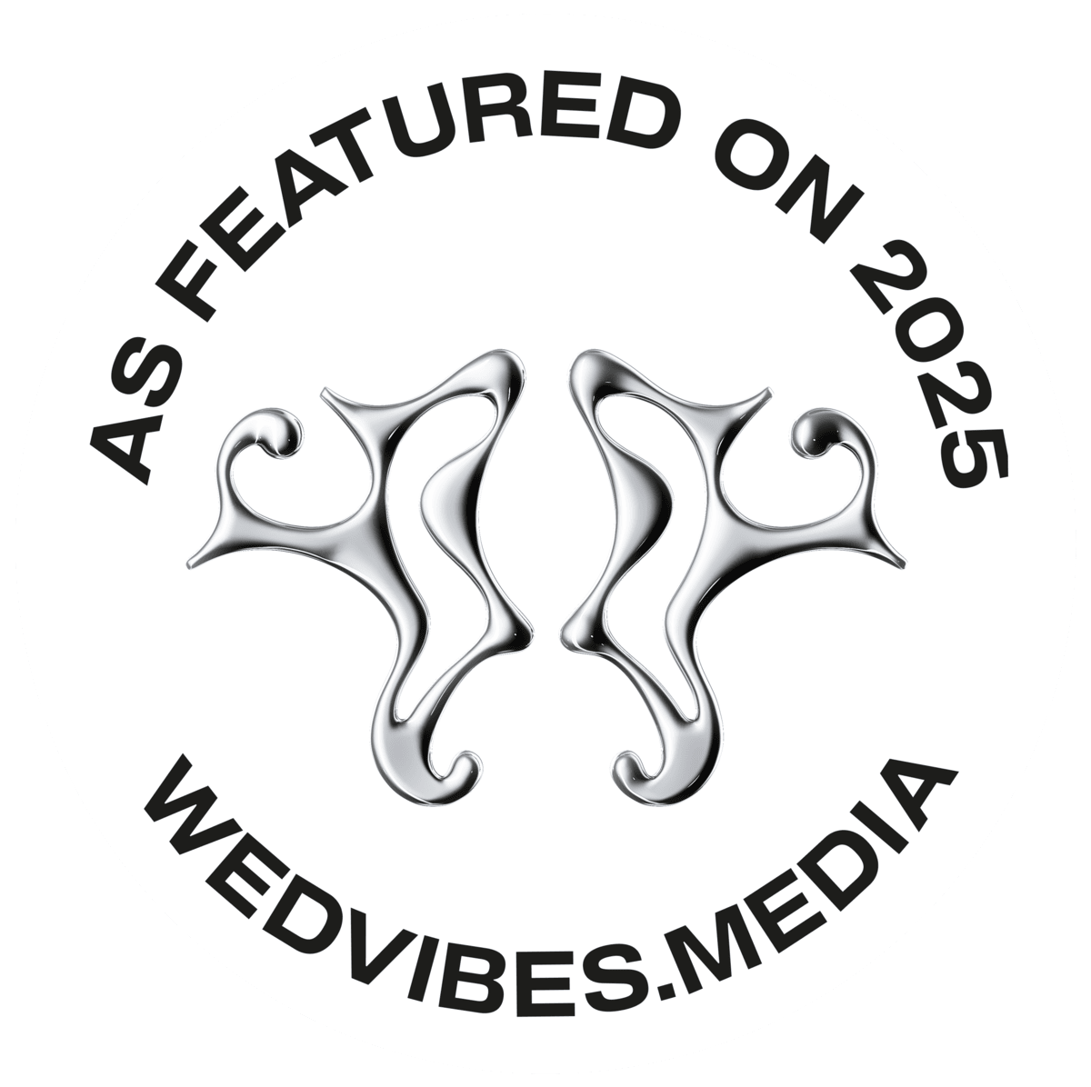 A black and white circular logo featuring mirrored seahorse-like shapes and text reading 'AS FEATURED ON 2025 WEDVIBES.MEDIA'.
