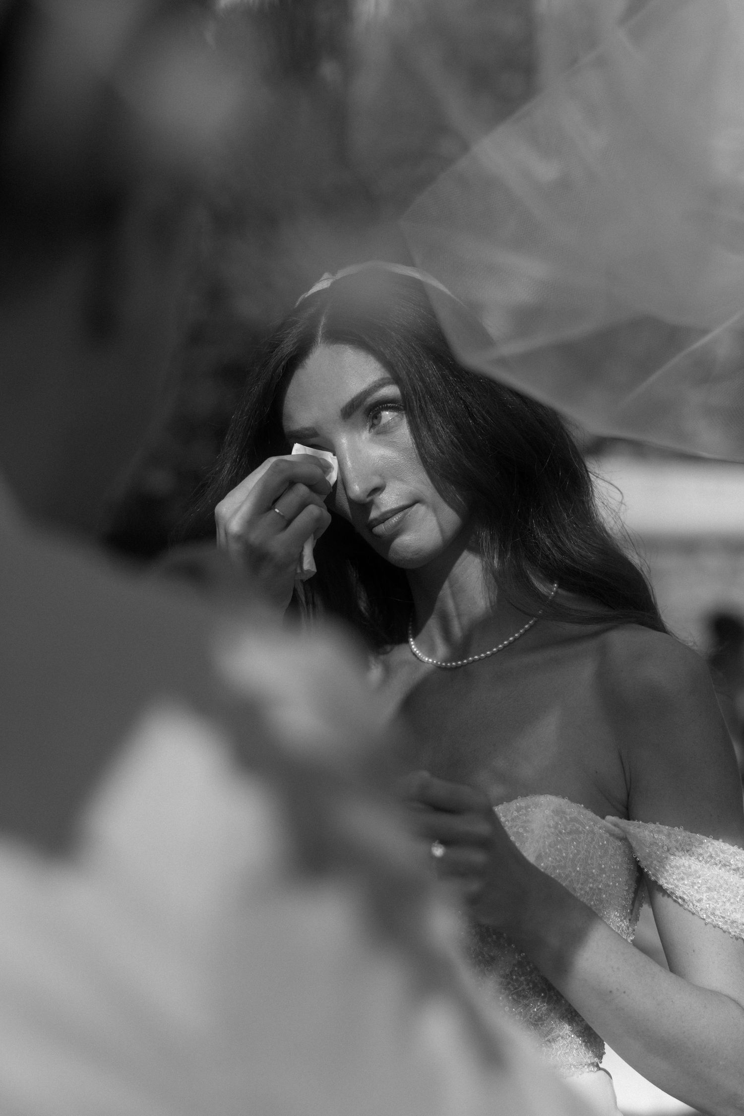 A dreamy black and white photo sequence shows a woman in a white dress posing with ethereal smoke effects.