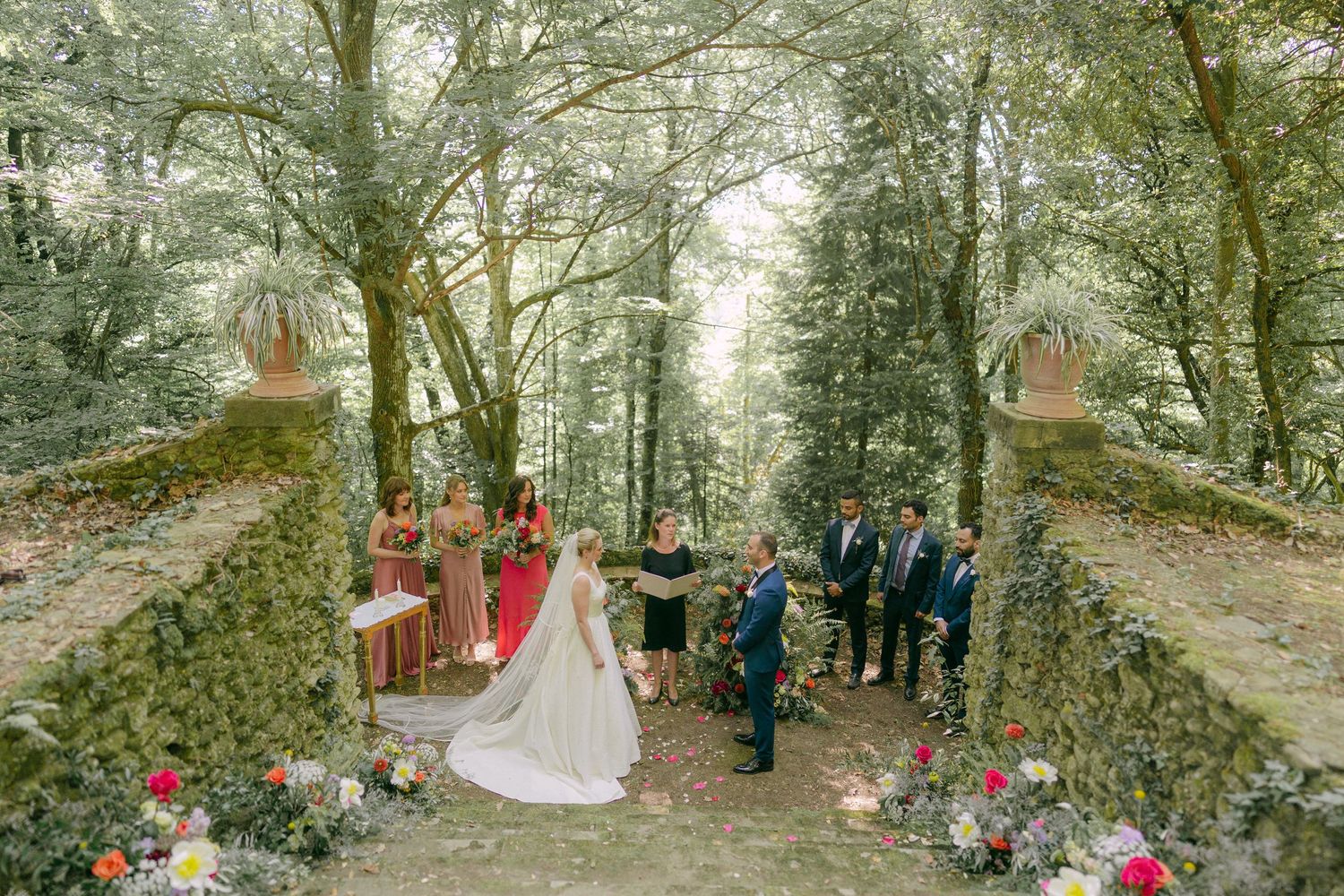 A series of outdoor woodland wedding ceremony photos showing guests gathered among tall trees and natural scenery.