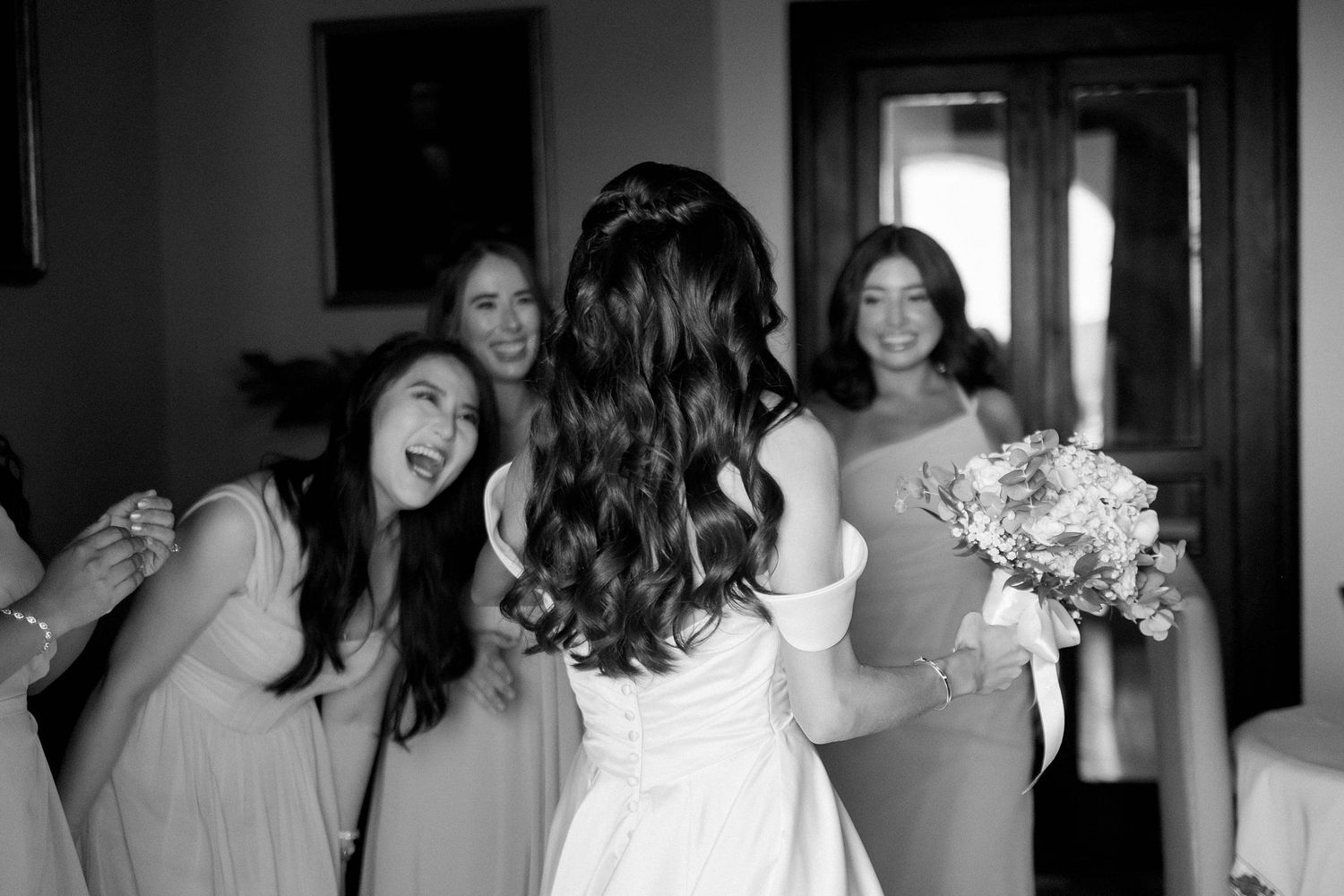 A series of black and white photos showing people dancing and celebrating at what appears to be a wedding reception.