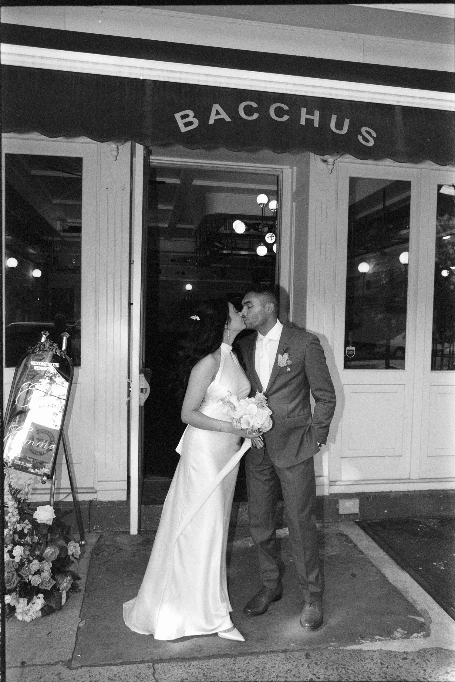 A sequence of five black and white photos showing a couple in formal wedding attire entering a venue called Bacchus.