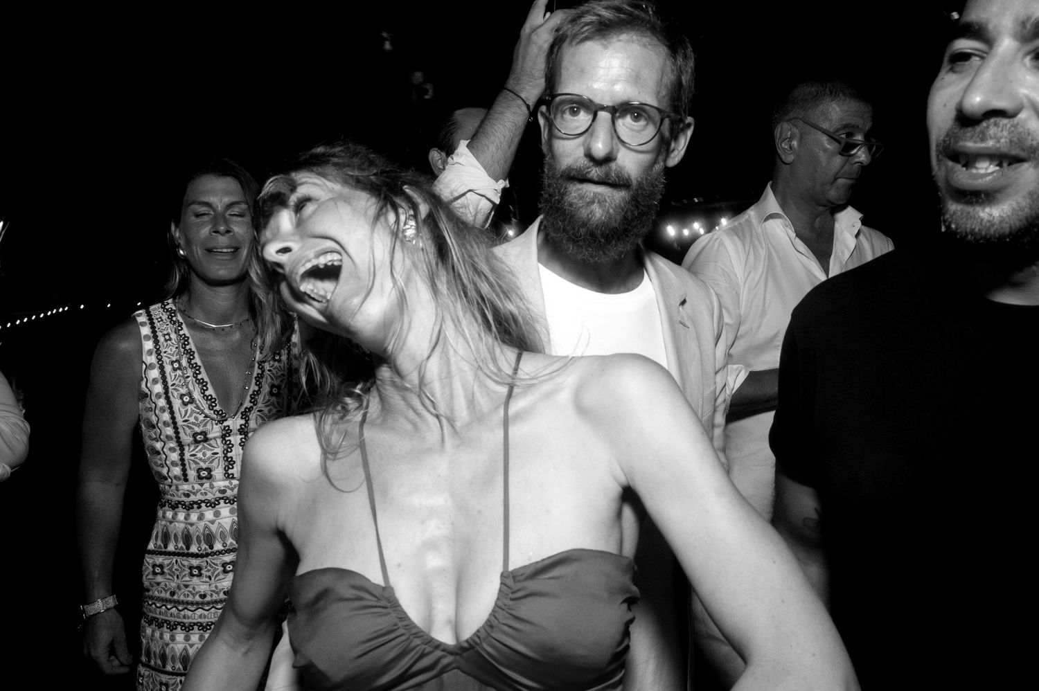 Black and white photo collage showing people dancing and socializing at what appears to be a nightclub or party setting.