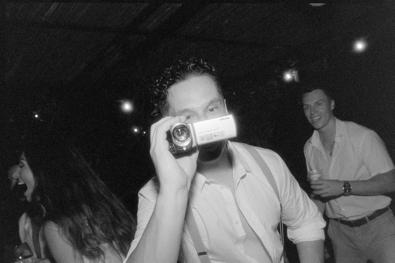 A black and white collage of vintage nightclub scenes showing people dancing and socializing in a dimly lit setting.