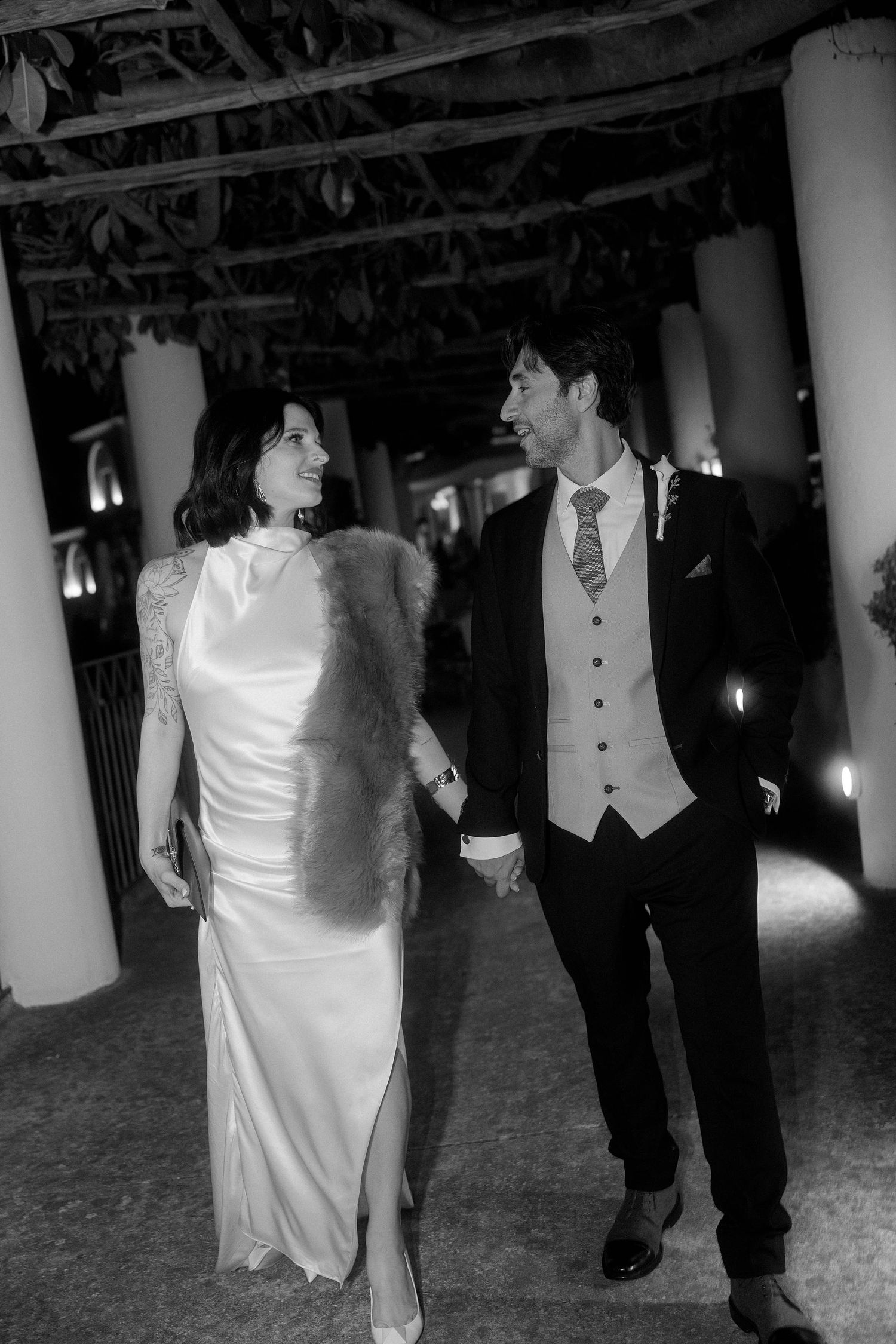 Black and white photo sequence showing a couple dancing together at a wedding reception, with the bride in white and groom in dark suit.