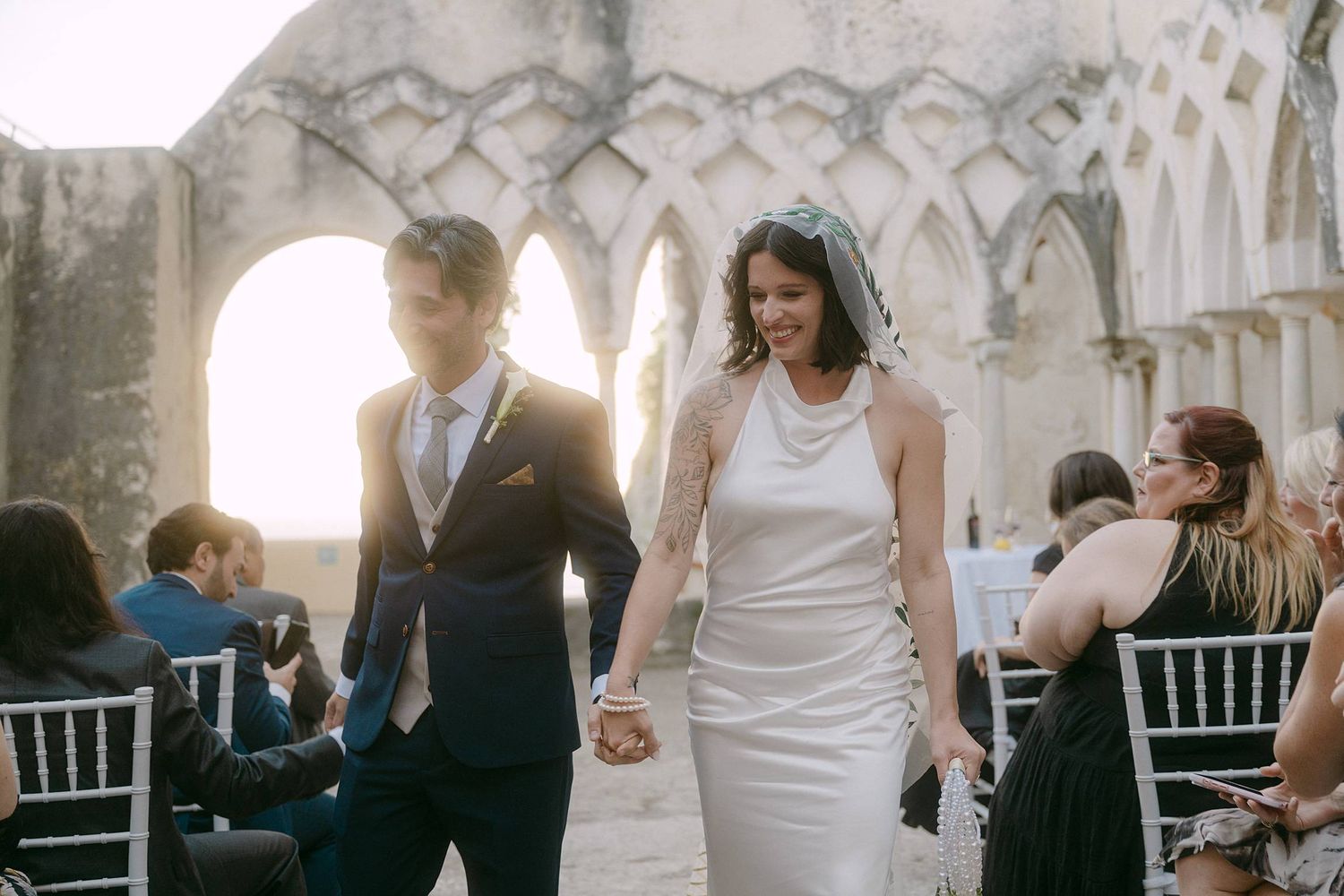 A series of candid wedding photos showing couples and guests celebrating at an outdoor reception in natural light.