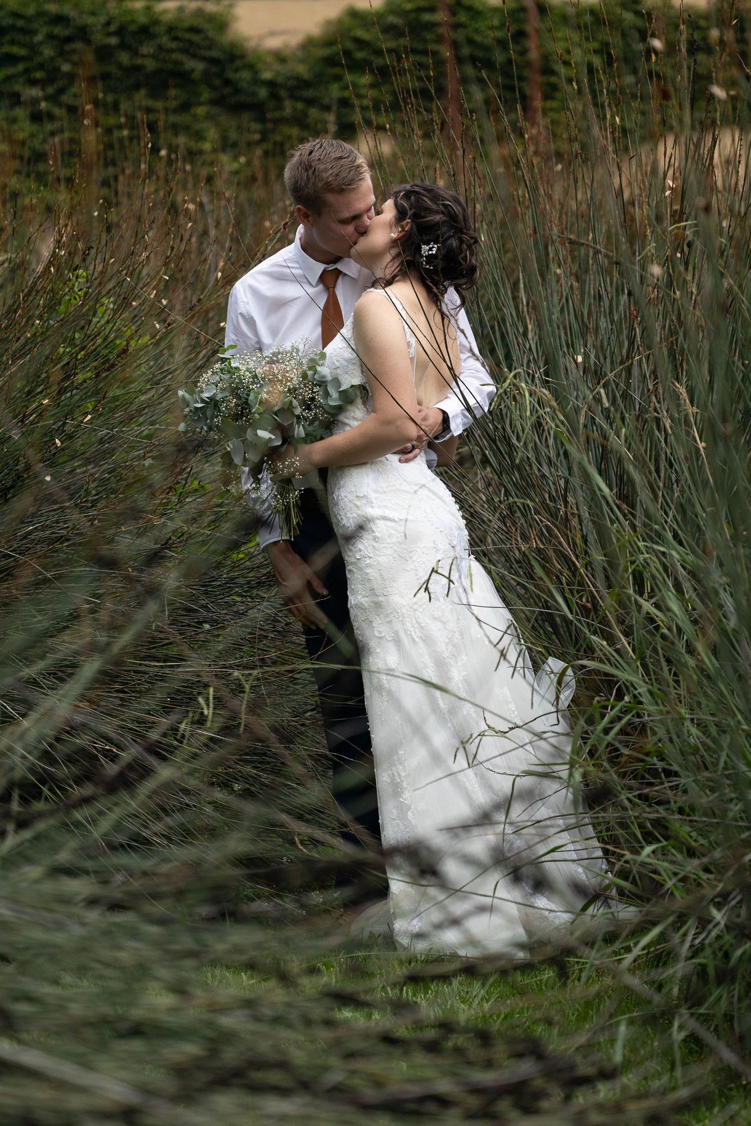 A candid kiss in the reeds at Cradle Valley
