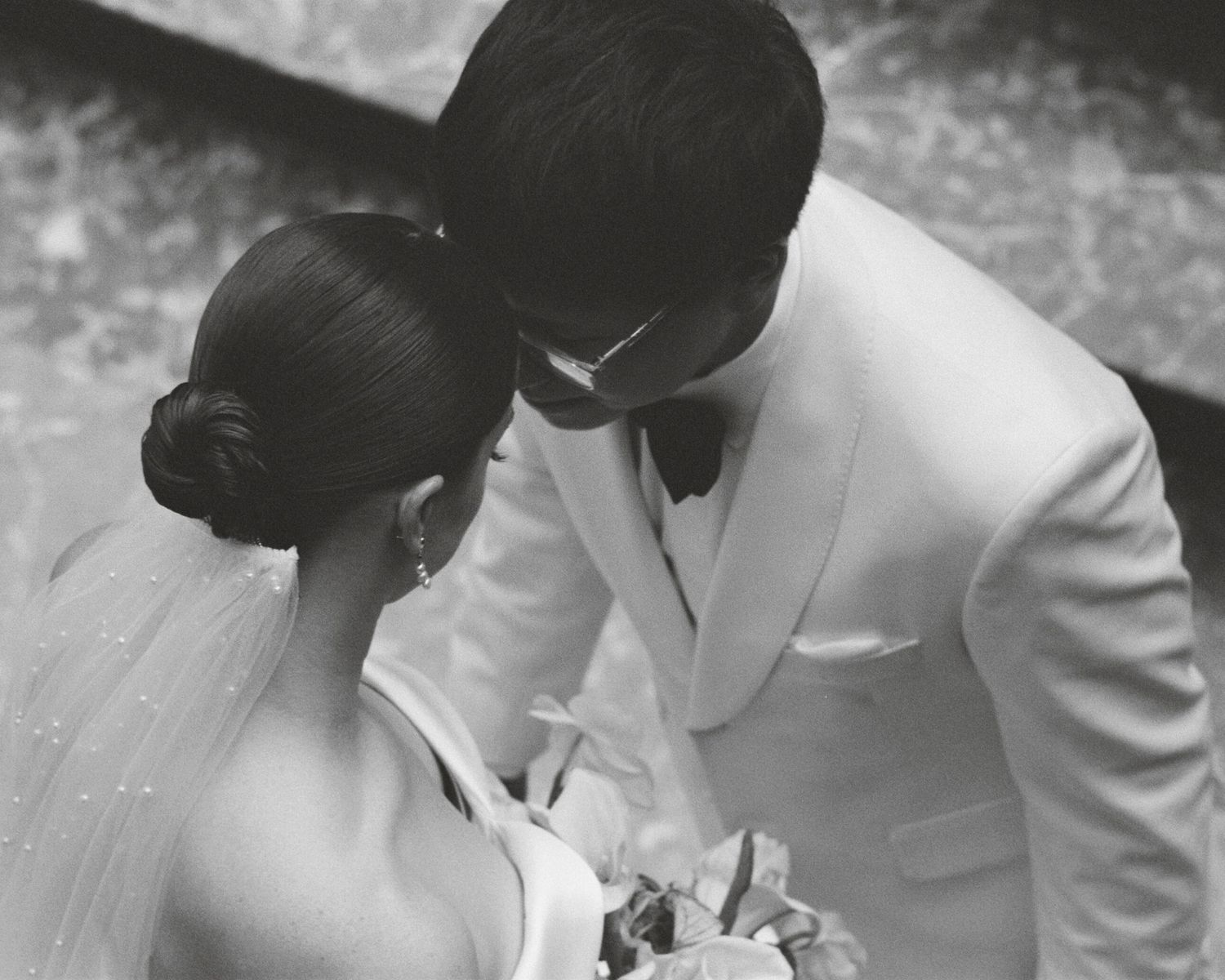 Black and white wedding photos capturing intimate moments between a couple.
