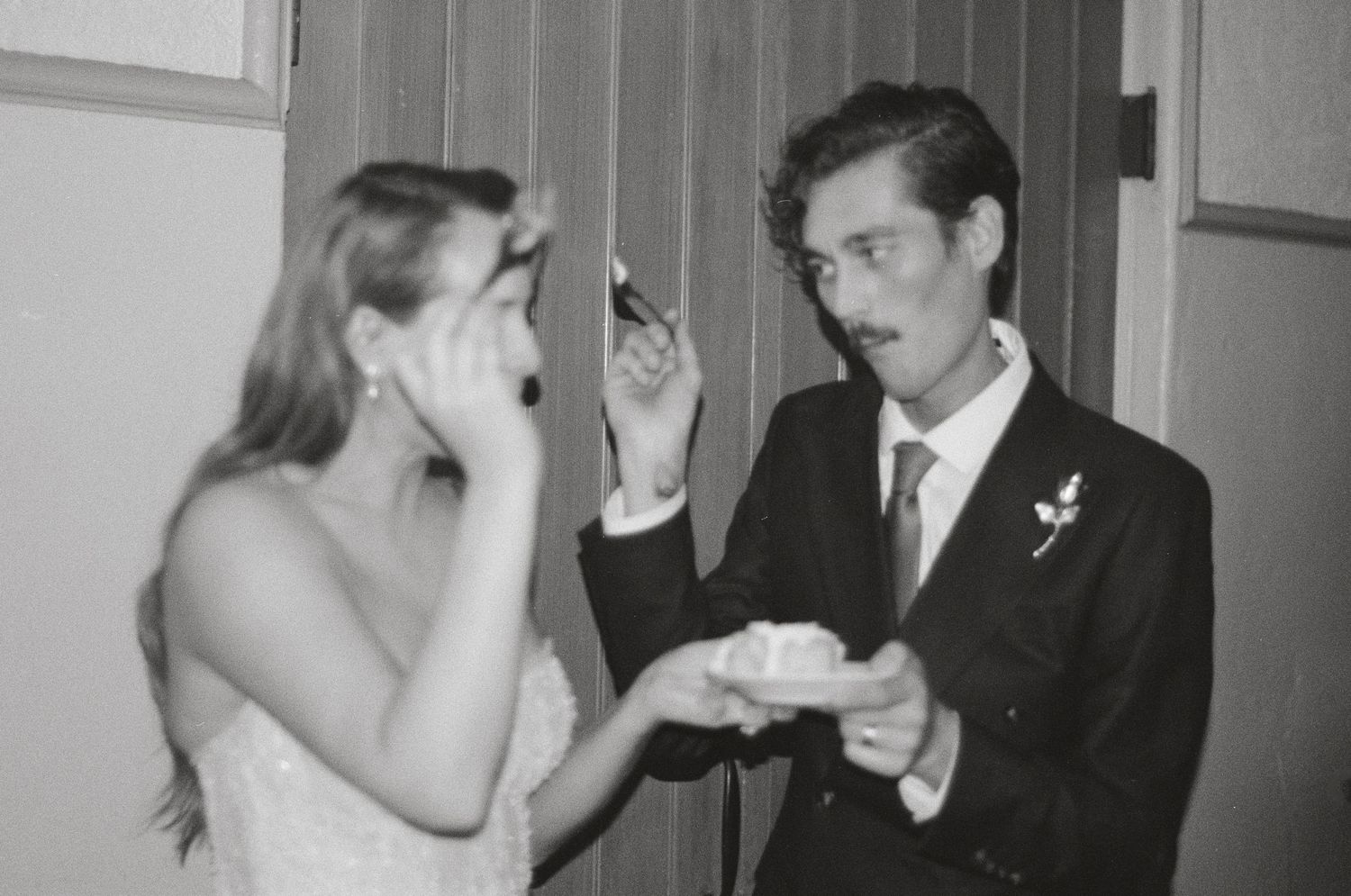 Series of candid reception moments captured in classic black and white photography.