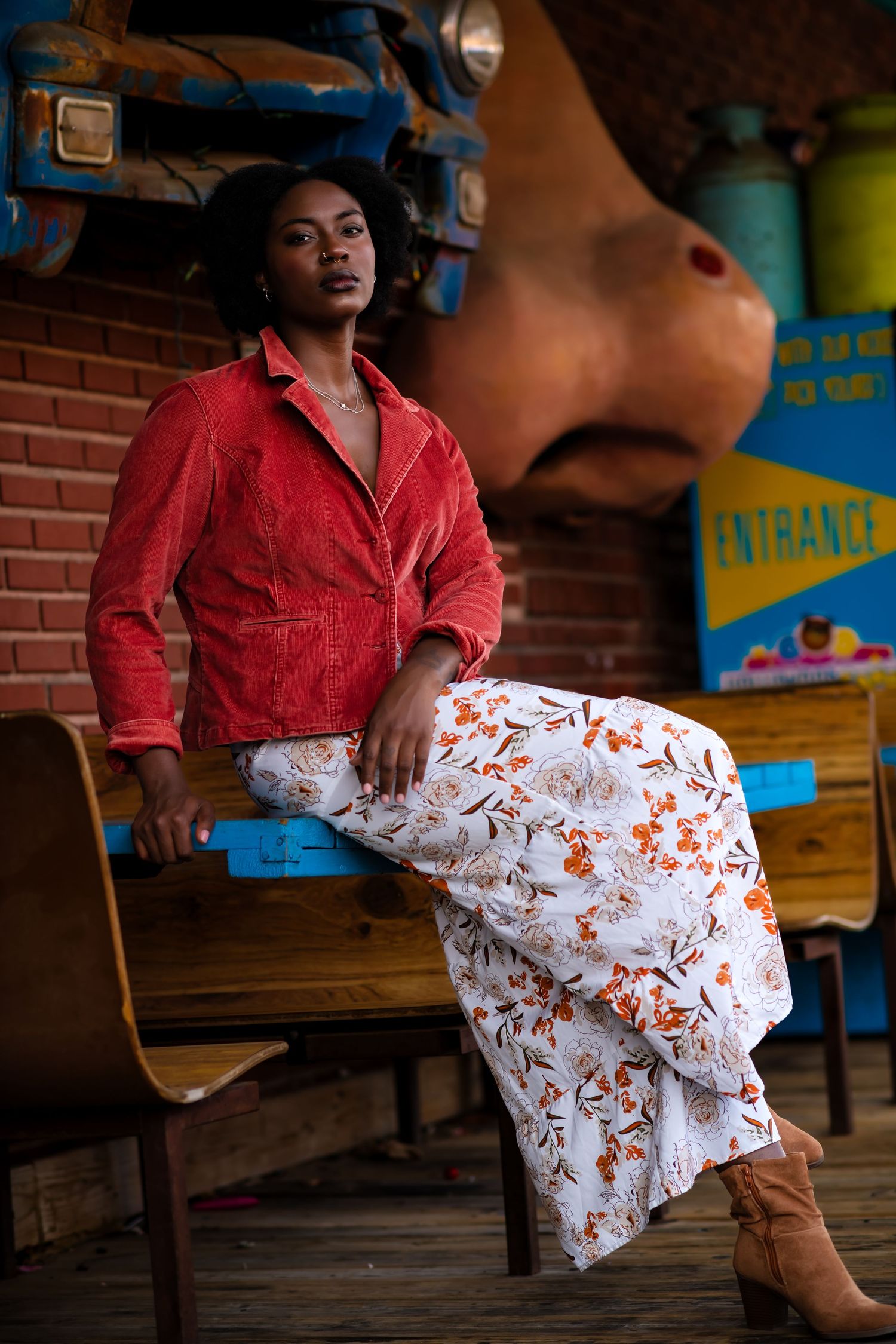 Fashion photo sequence showing floral white skirt with red top and brown boots in rustic brick setting.