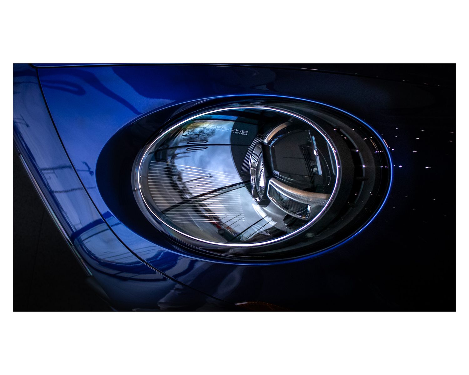 Close-up of a modern Porsche headlight with LED lighting system.
