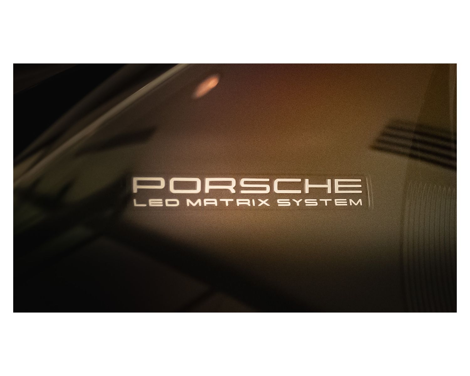 Porsche LED Matrix System text illuminated on a car surface.