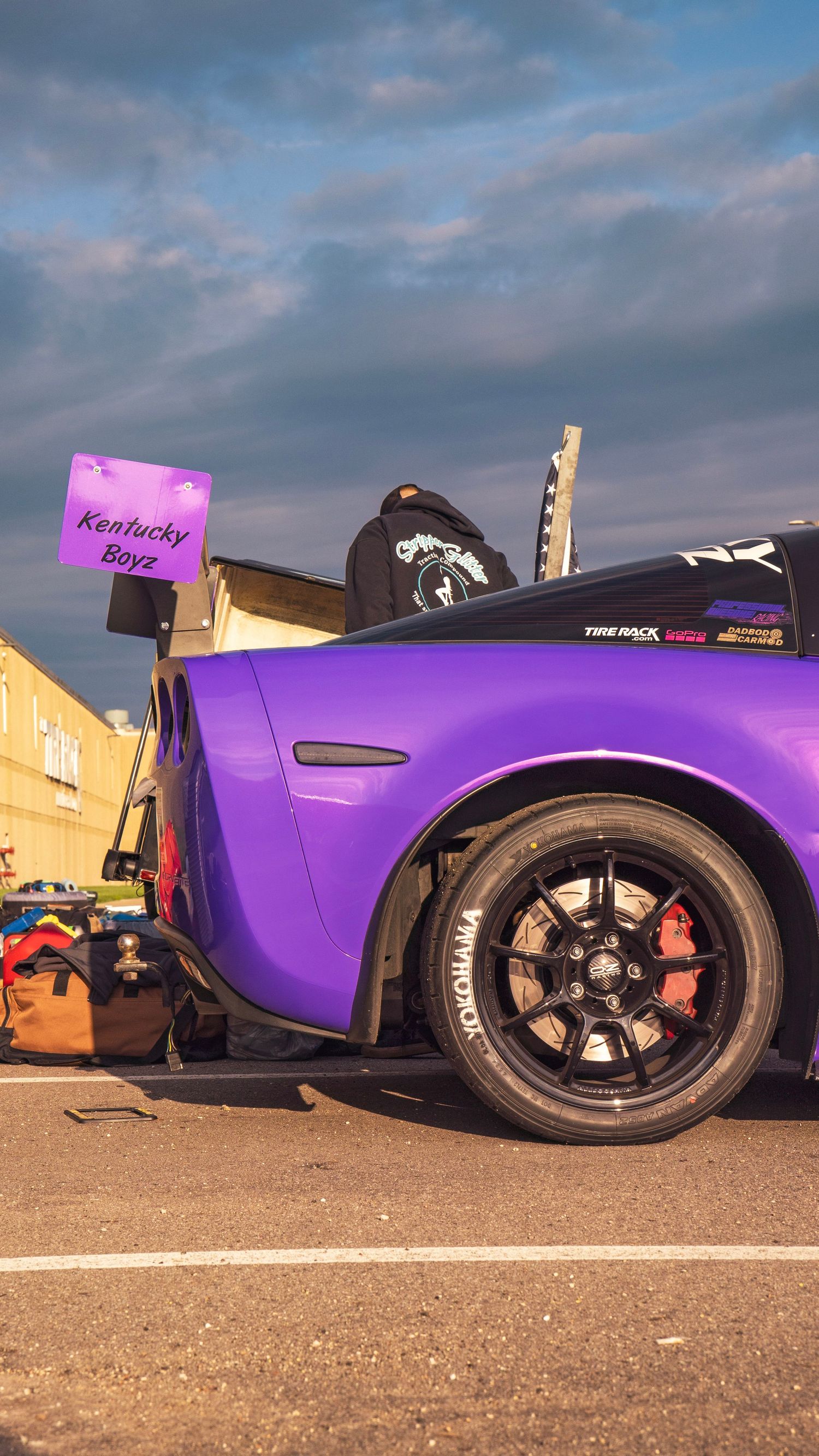 Purple Corvette with Kentucky Boyz signage showing custom wheel and brake setup.