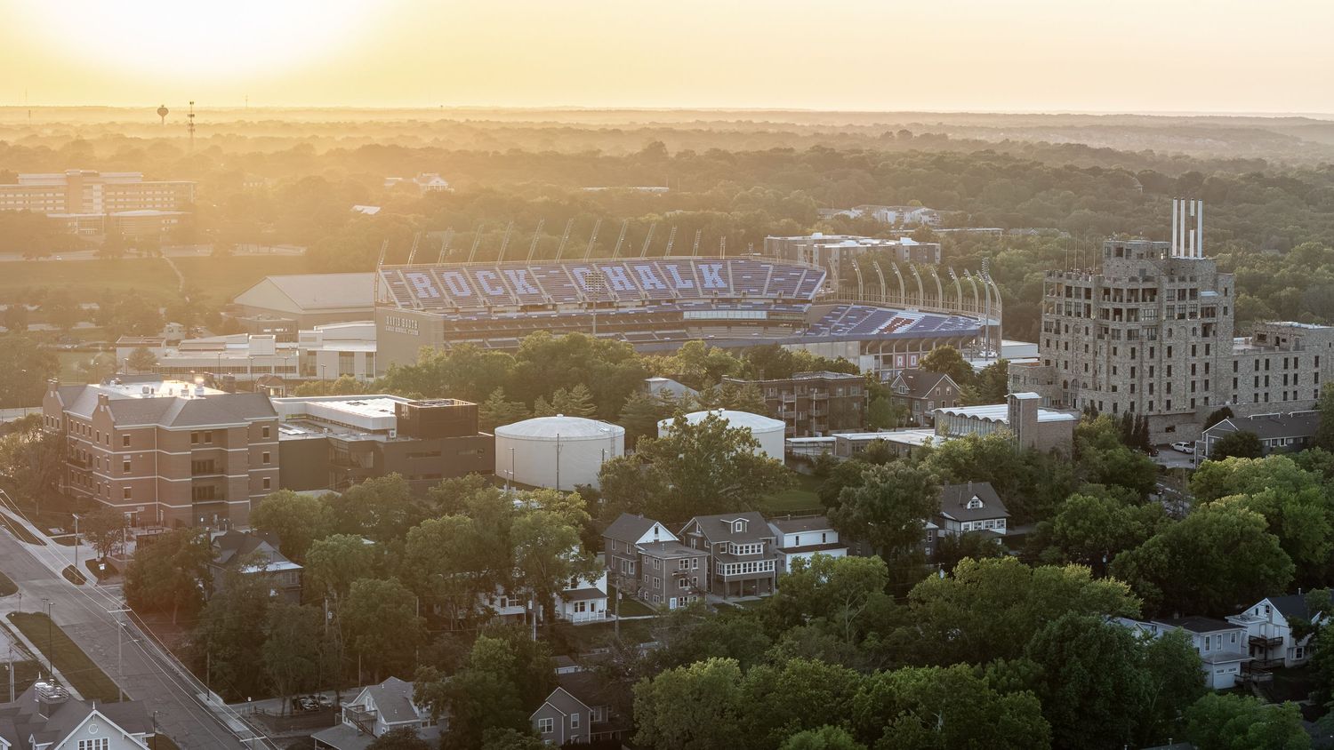 Sunset photo by Derek Mecca of the Jayhawk Stadium in Lawrence KS. Produced for a local AirBnB short term rental.