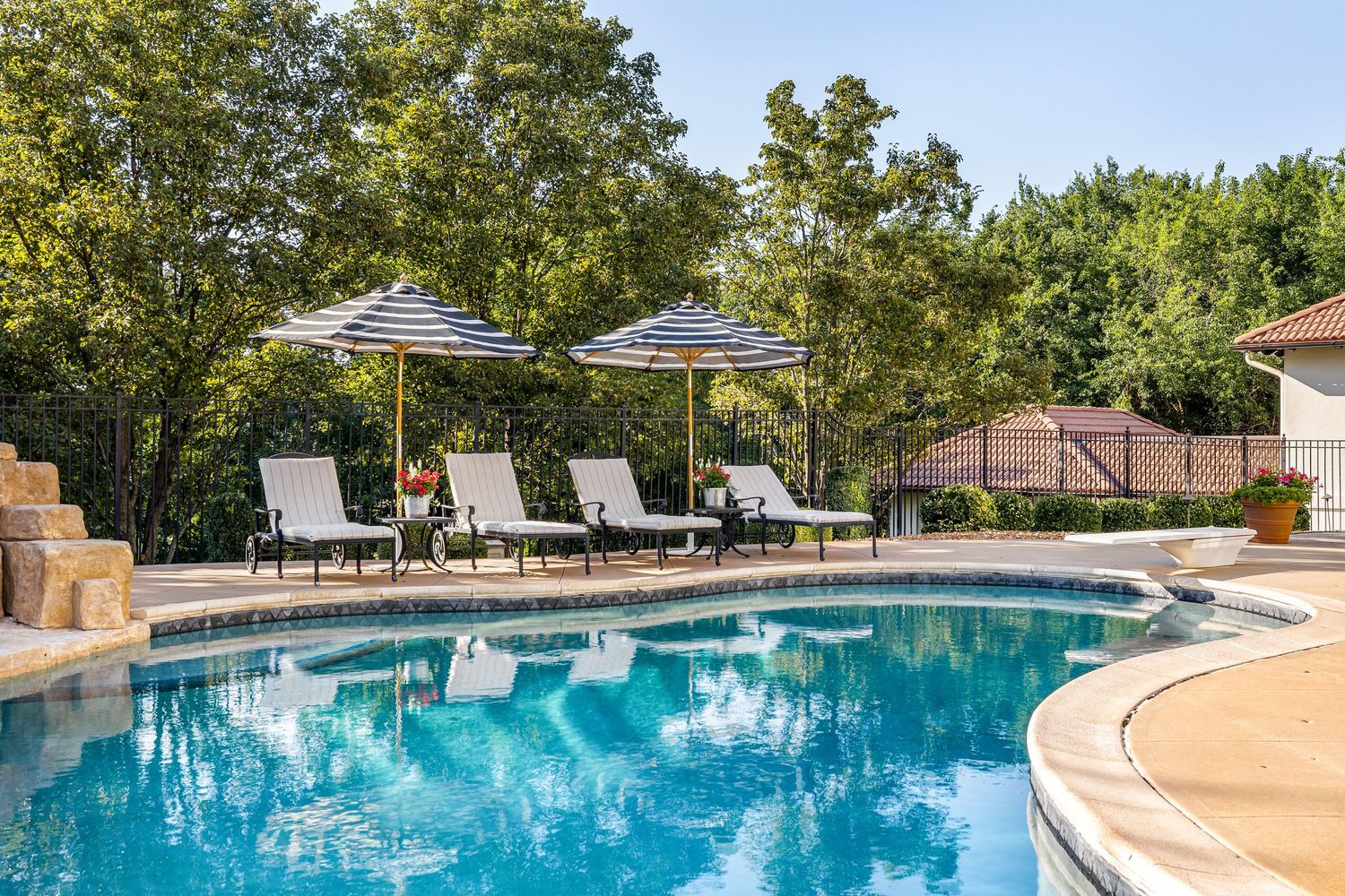 Lifestyle photo of a luxury pool. Photography produced by Derek Mecca, a photographer in Kansas.