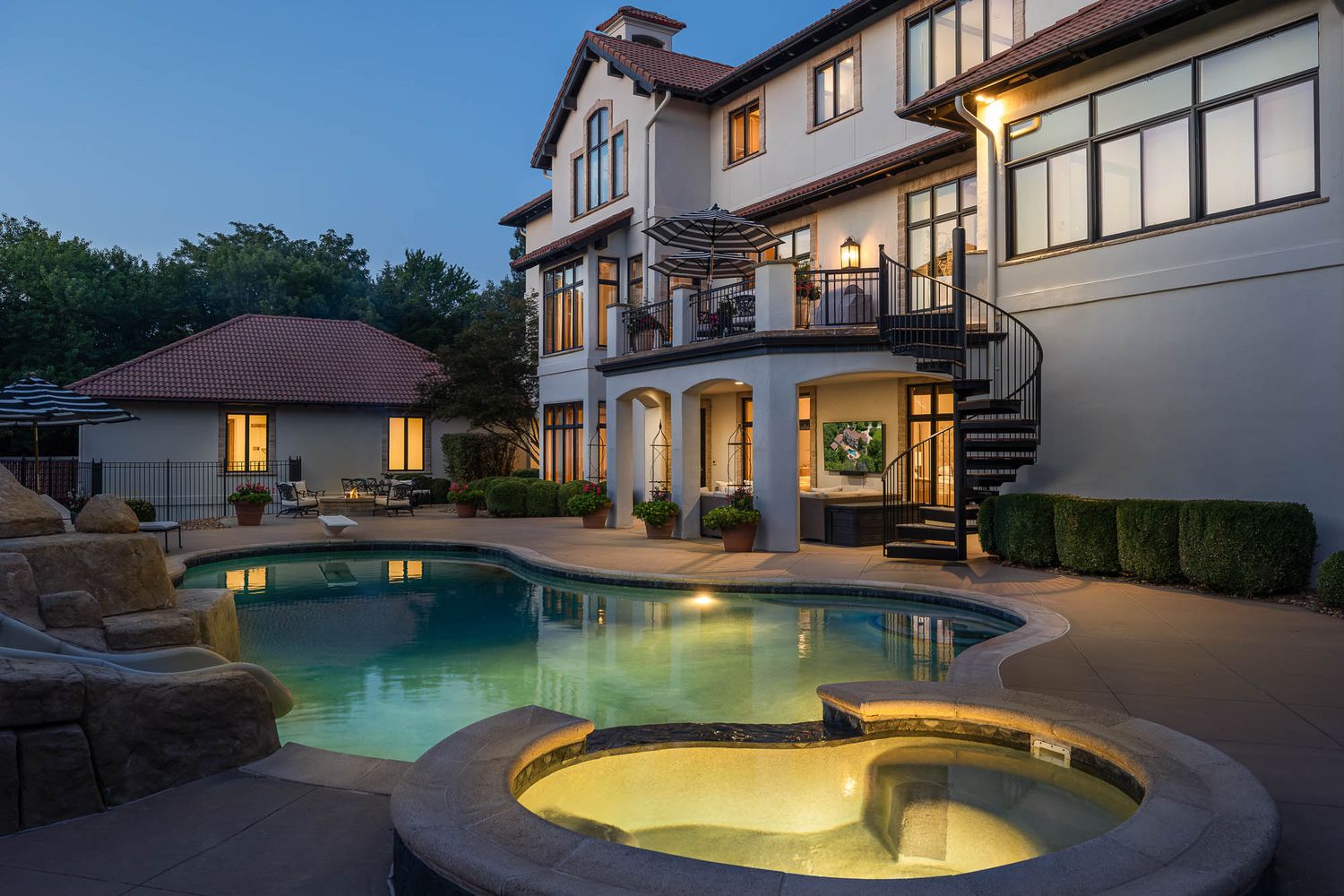 Authentic twilight photo of the outdoor pool at Danny Manning's custom built home in Lawrence, KS. Photo produced by Derek Mecca.
