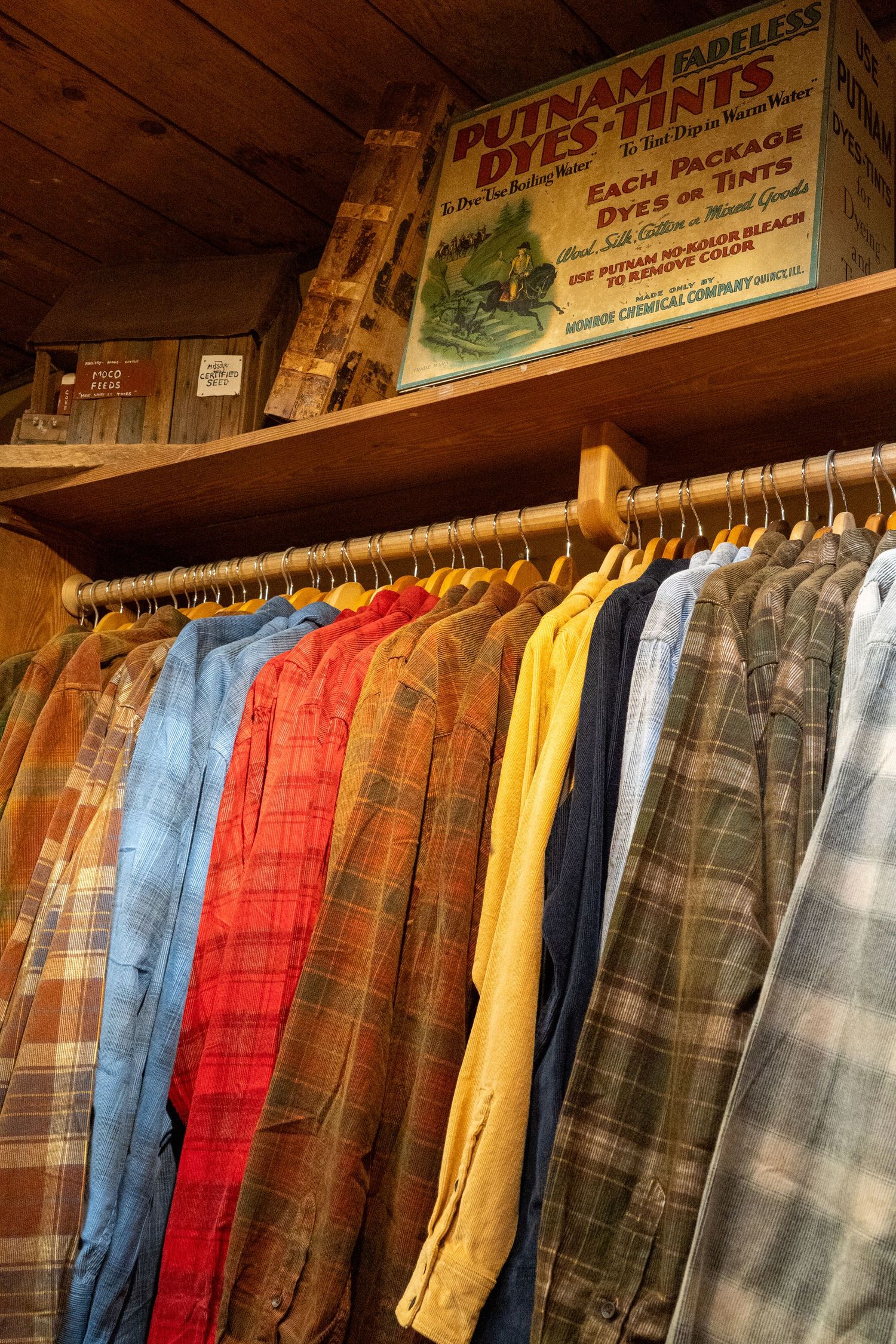Western flannels shirts are photographed against a retro authentic sign