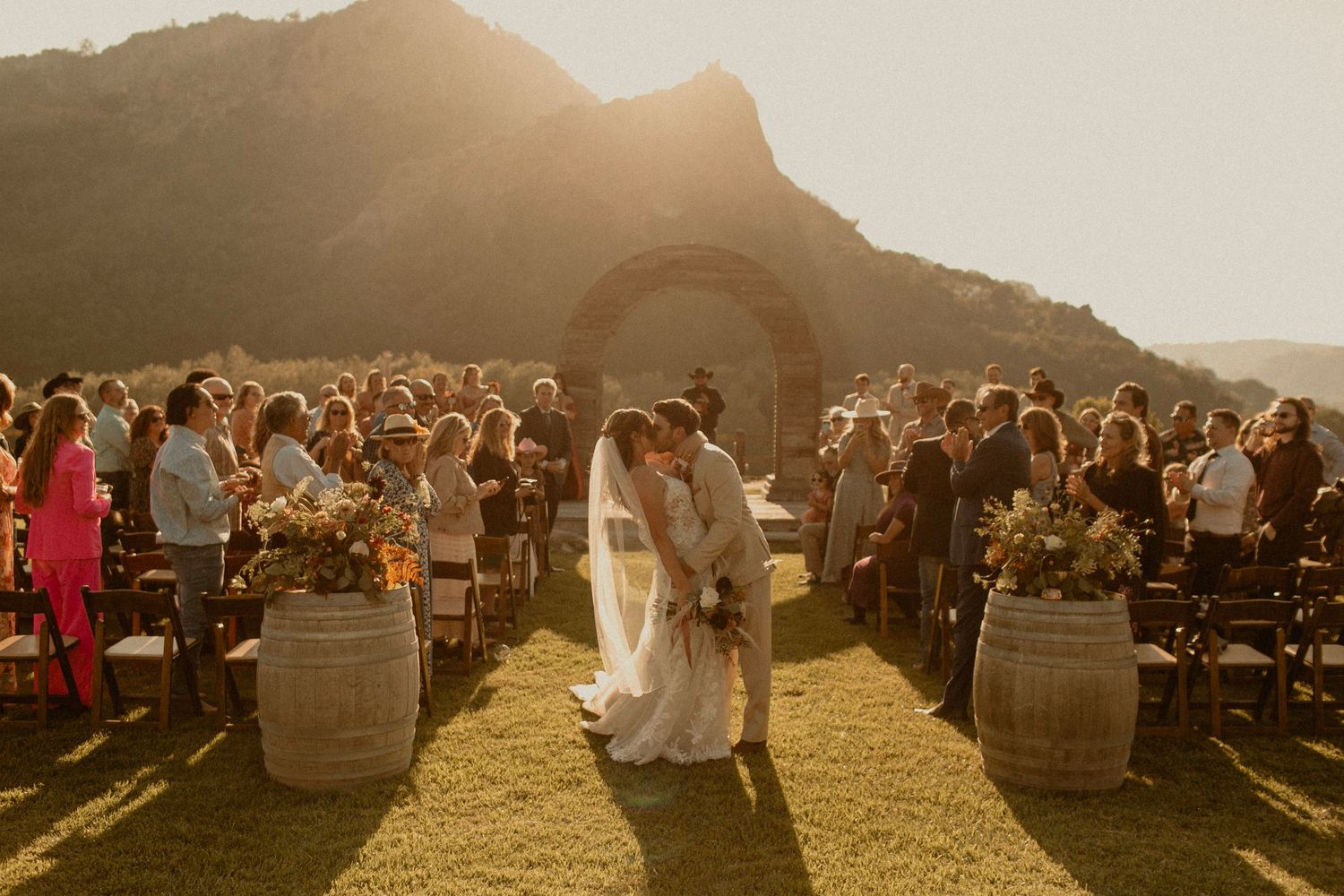 golden hour wedding featuring floral arrangements framing an aisle in San Luis Obispo County, California