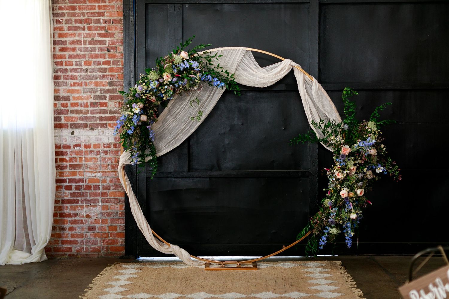 whimsical, garden-inspired arch arrangements for a summer wedding in San Luis Obispo, California