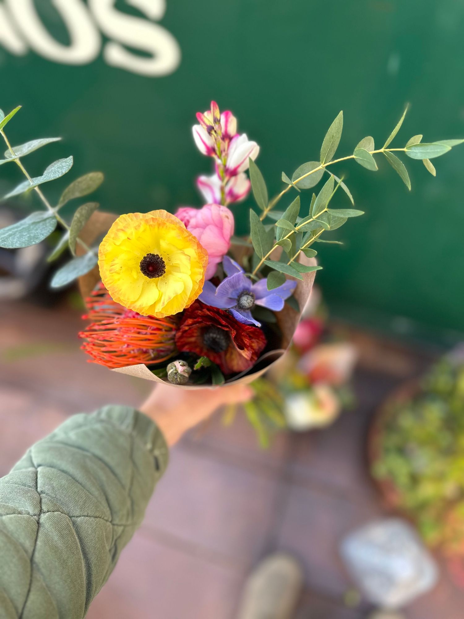 colorful local flower bouquet displayed in front of a local business in Atascadero