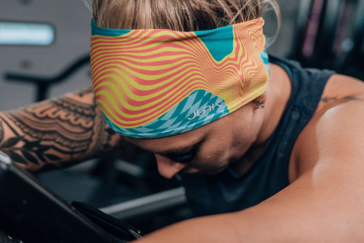Close-up of colorful wave-patterned athletic gear in teal and orange.
