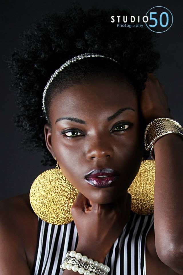Glamour portraits with black and white striped elements and gold accents against dark background.
