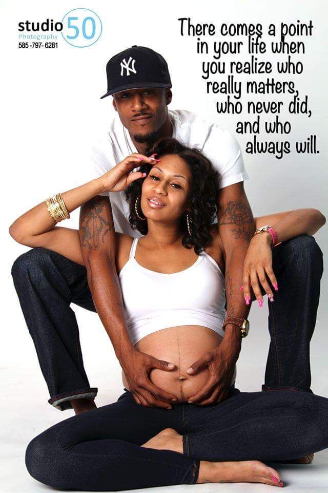 Studio maternity session with casual urban styling and text overlay.