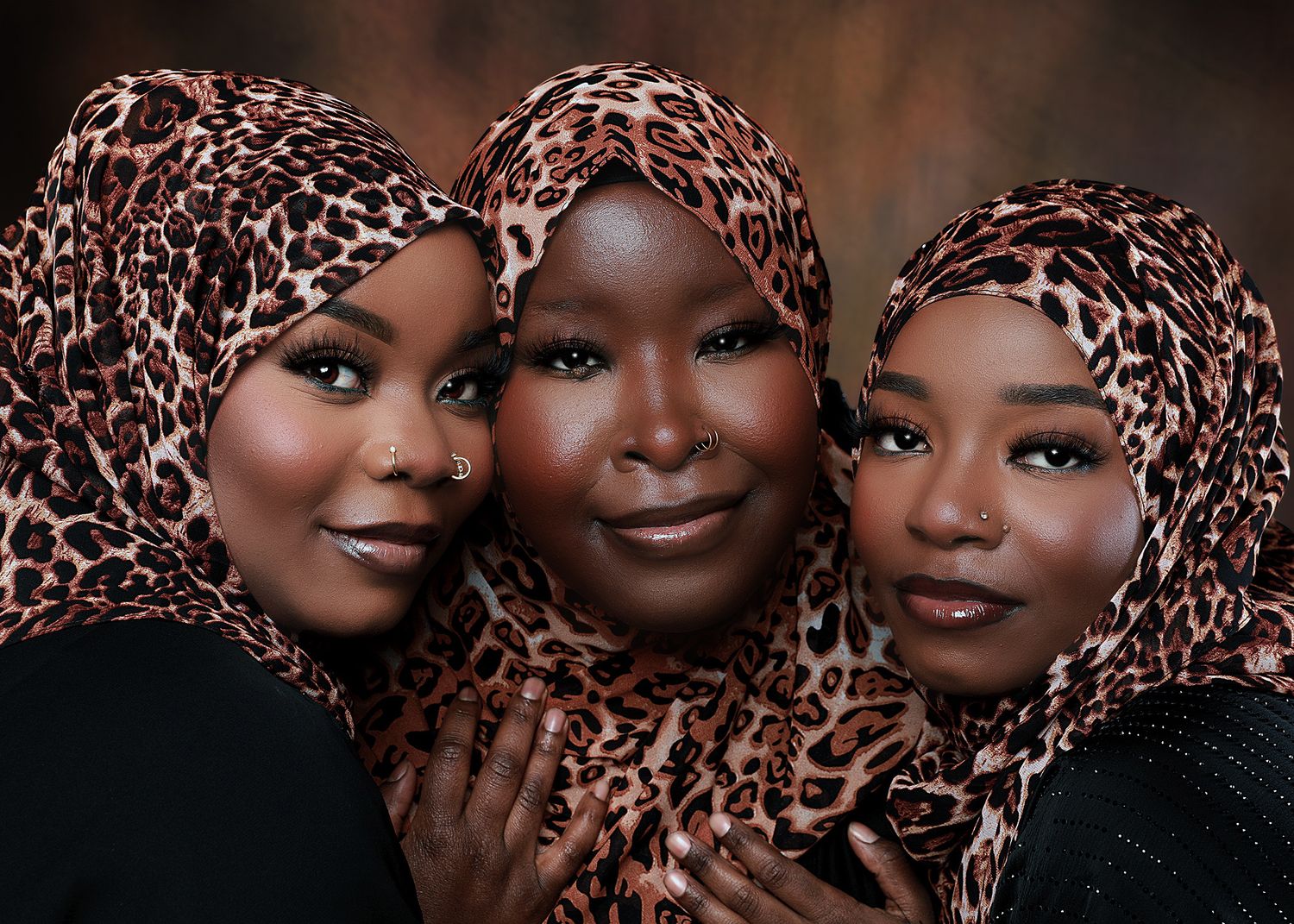 Beautiful portrait series showcasing women wearing patterned head wraps against a dark background.