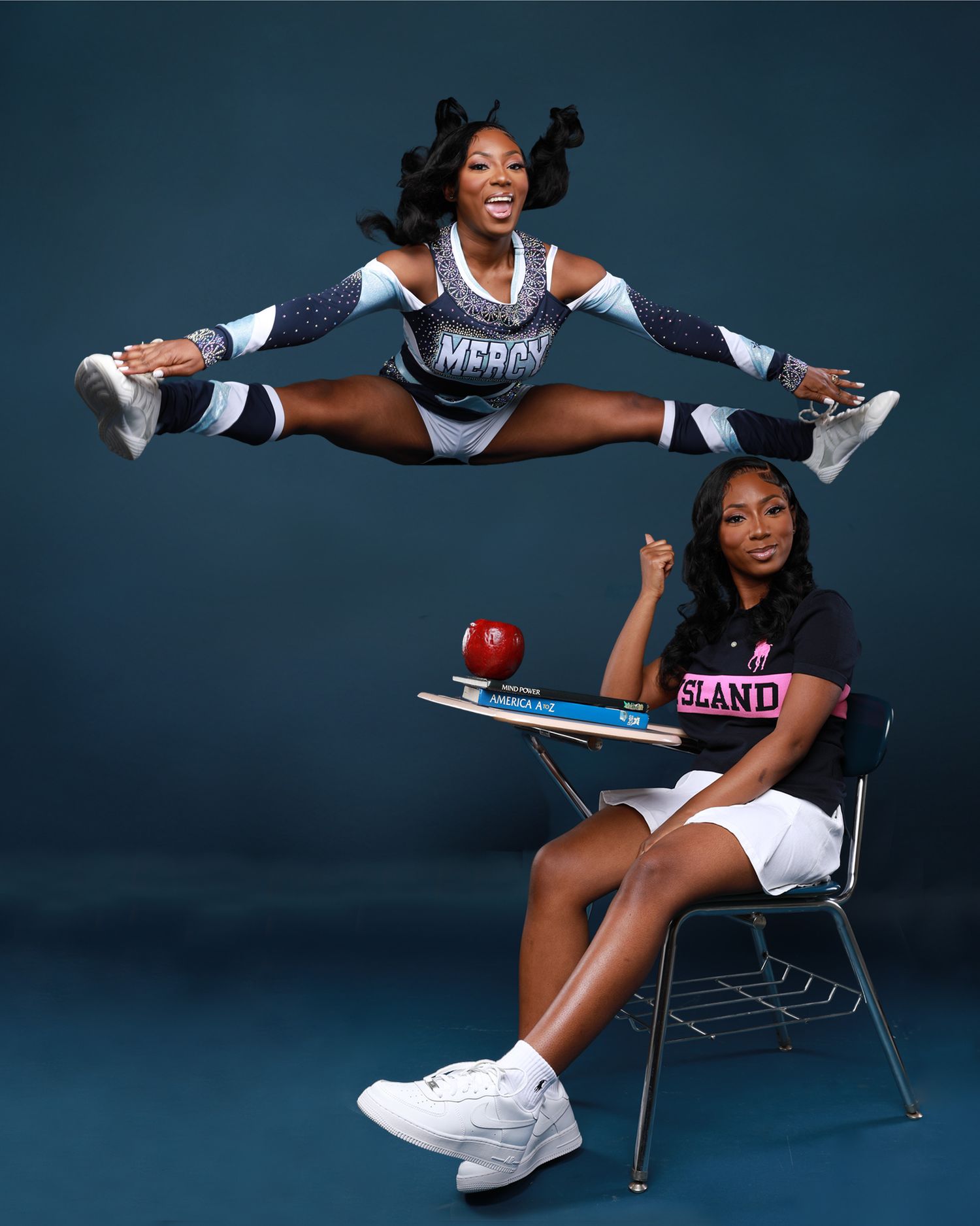 Cheerleader performs split jump above seated student in classroom setting.