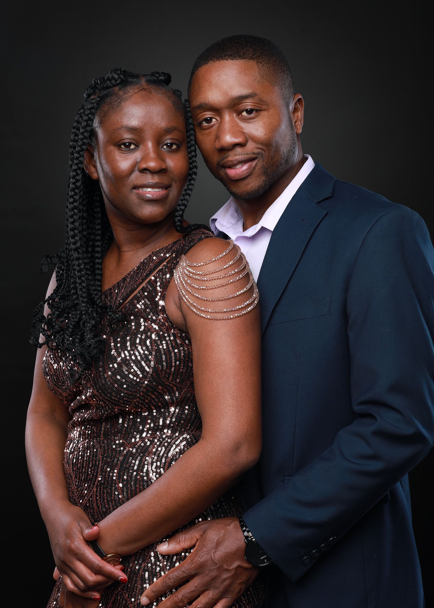 Romantic sequence of a couple in formal wear, with sparkling dress and navy suit.