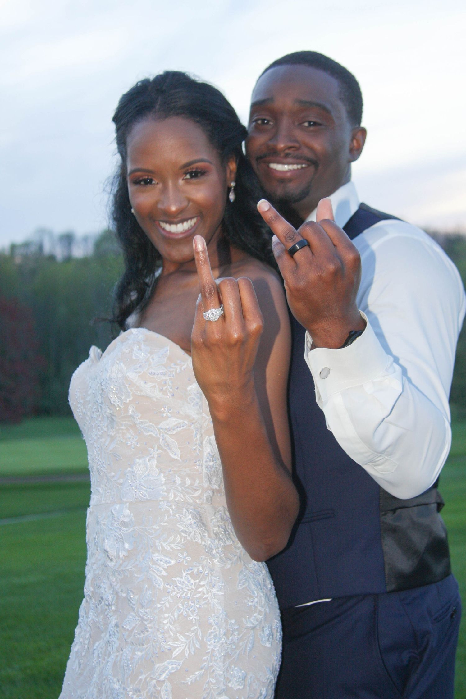 Joyful engagement photo series of couple showing off ring in outdoor setting.