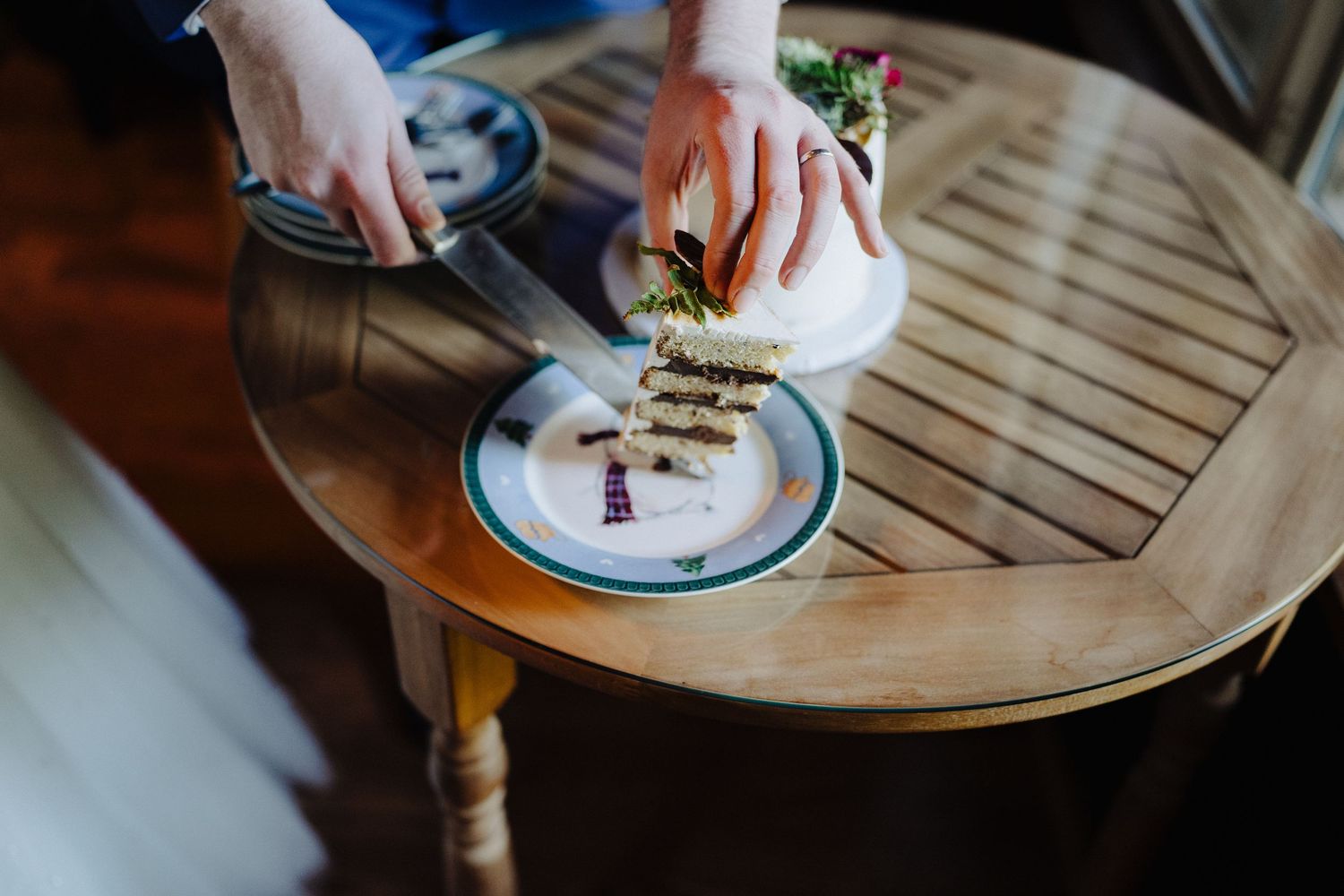 Closeup of dessert plates being served at an elegant wedding reception.
