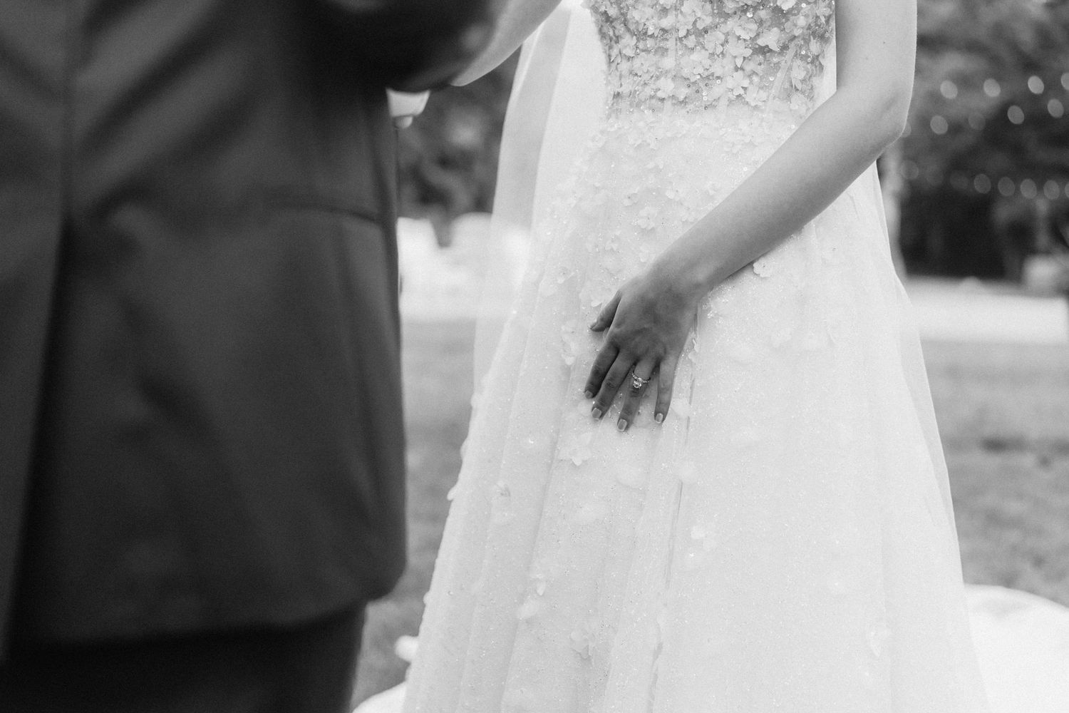 A bride and groom share an intimate moment while dancing together at their wedding reception.