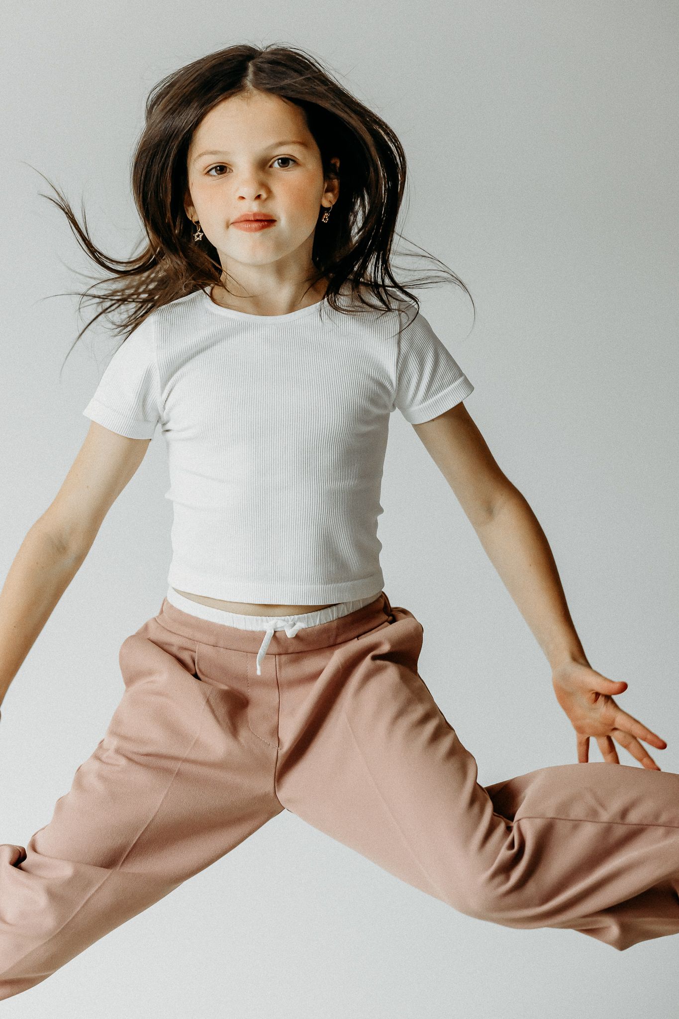 girl fashion photo jumping in Chicago studio