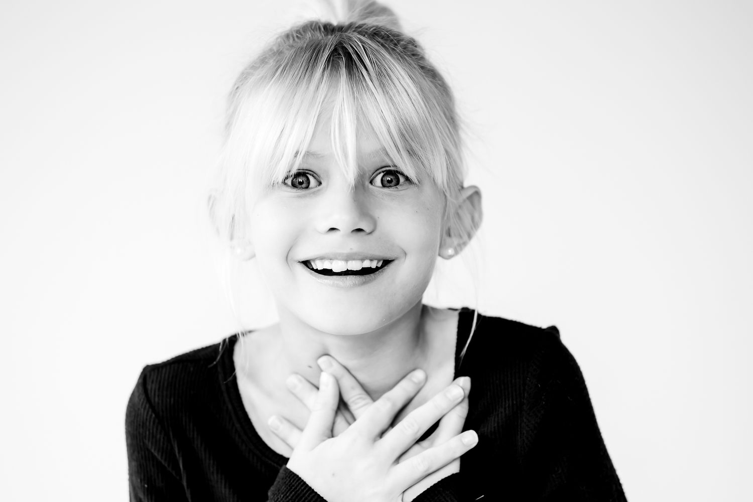 Studio black and white kids portrait session with playful expressions in Highland Park