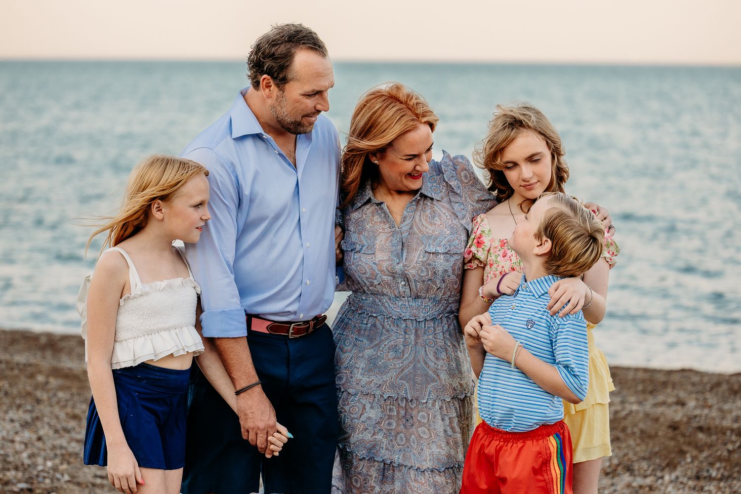 Family sharing a emotional moment during a glencoe family beach session