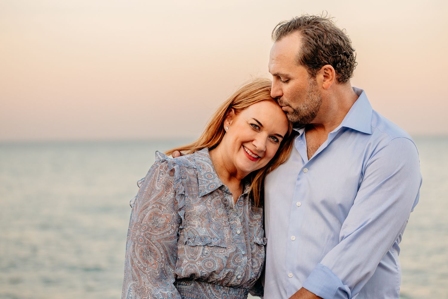 Intimate parent moment during a family beach session in Glencoe