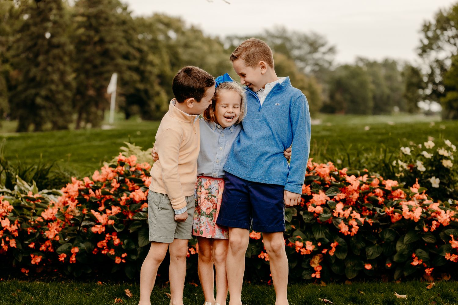 Sibling hug during Itasca family mini session in fall colors