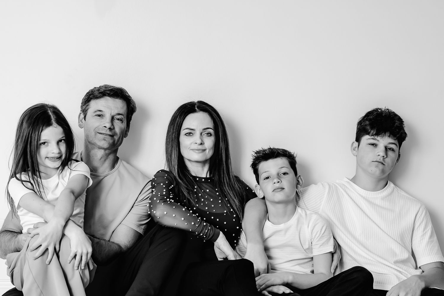 Black and White Highland Park Studio family photo with parents and kids interacting naturally